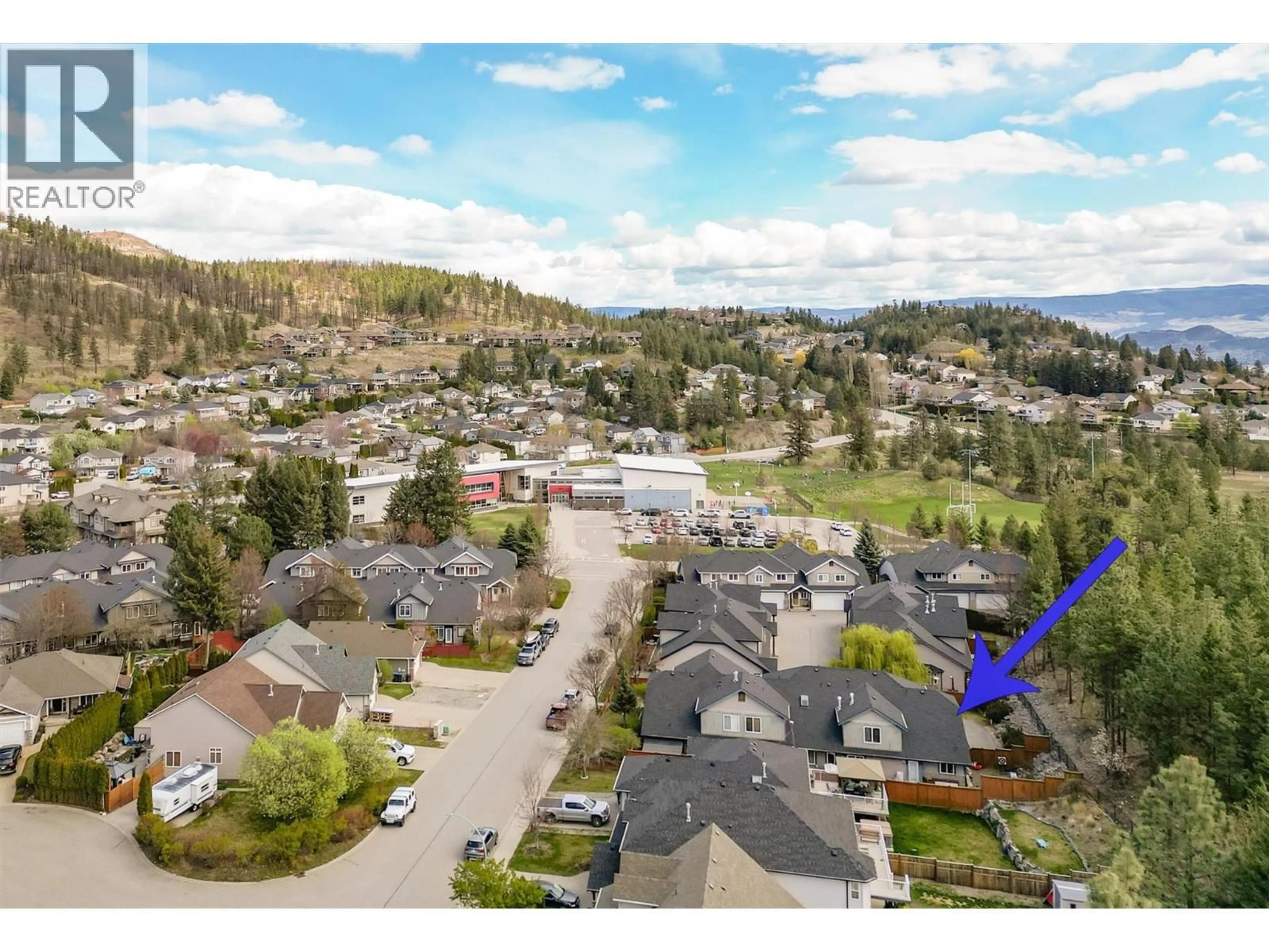 A pic from outside/outdoor area/front of a property/back of a property/a pic from drone, mountain view for 1 - 1451 ROSEMEADOW DRIVE, West Kelowna British Columbia V1Z4A4