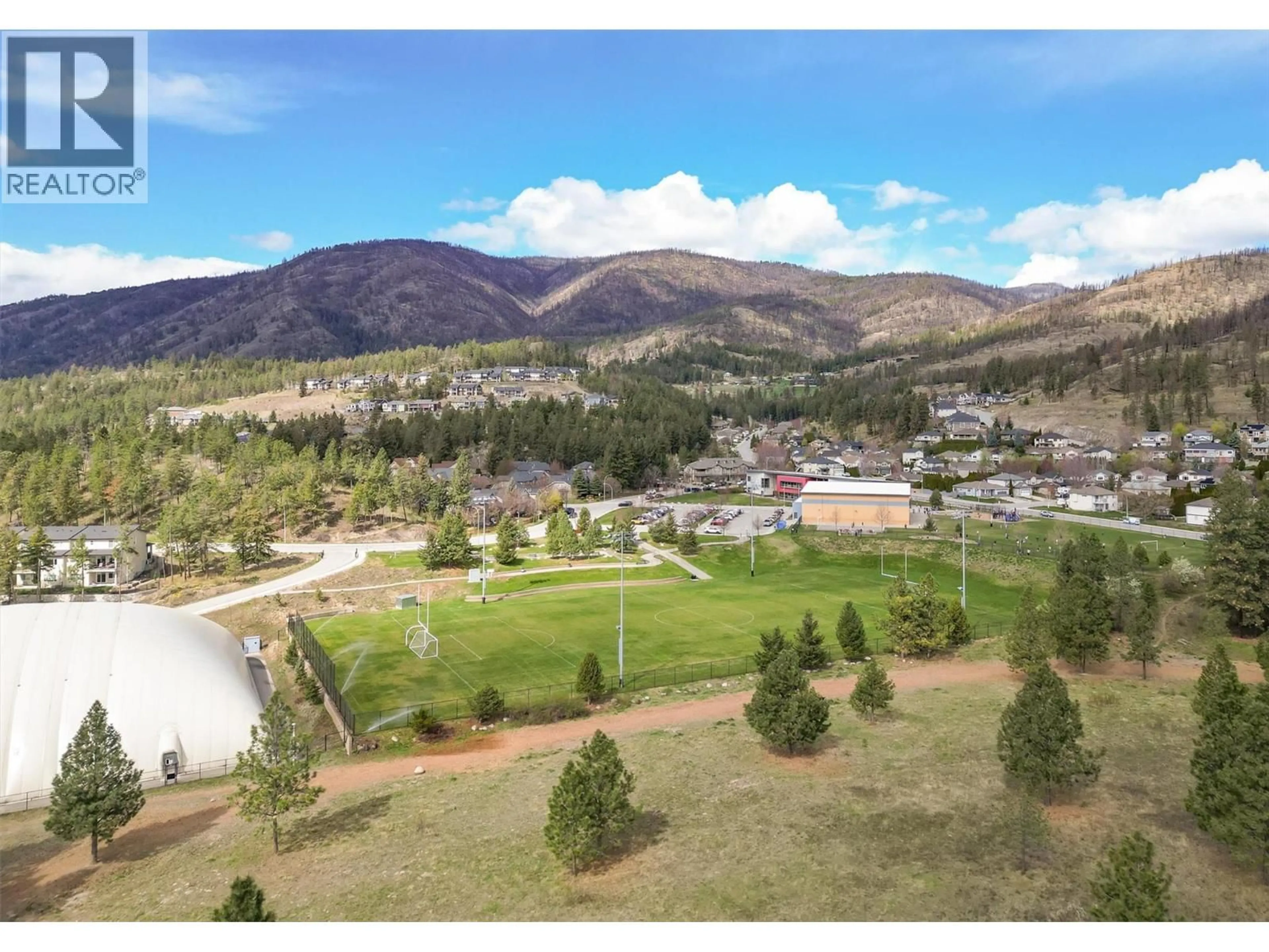 A pic from outside/outdoor area/front of a property/back of a property/a pic from drone, mountain view for 1 - 1451 ROSEMEADOW DRIVE, West Kelowna British Columbia V1Z4A4