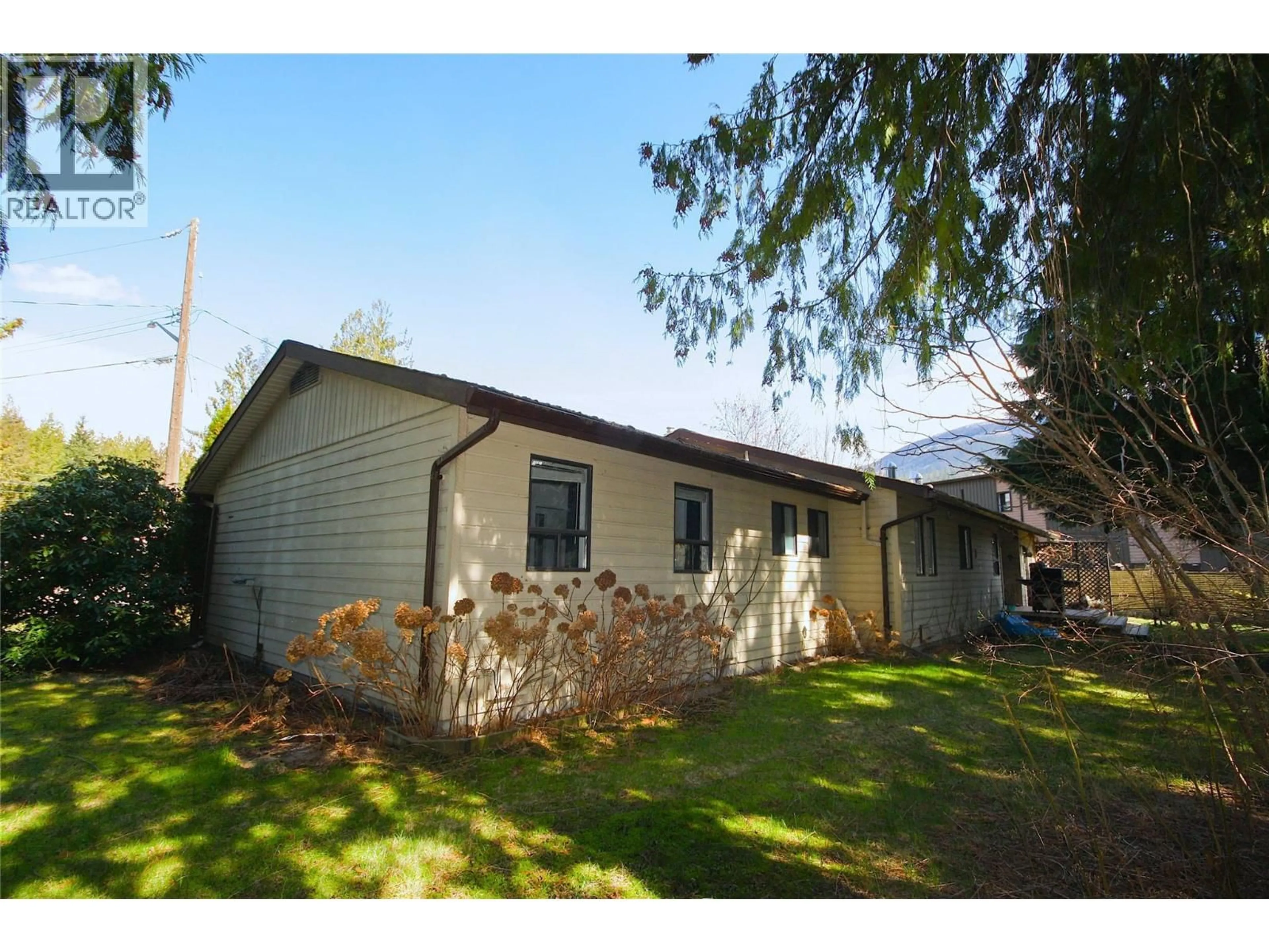 Home with vinyl exterior material, street for 1402 AMHURST ROAD, Sicamous British Columbia V0E2V0