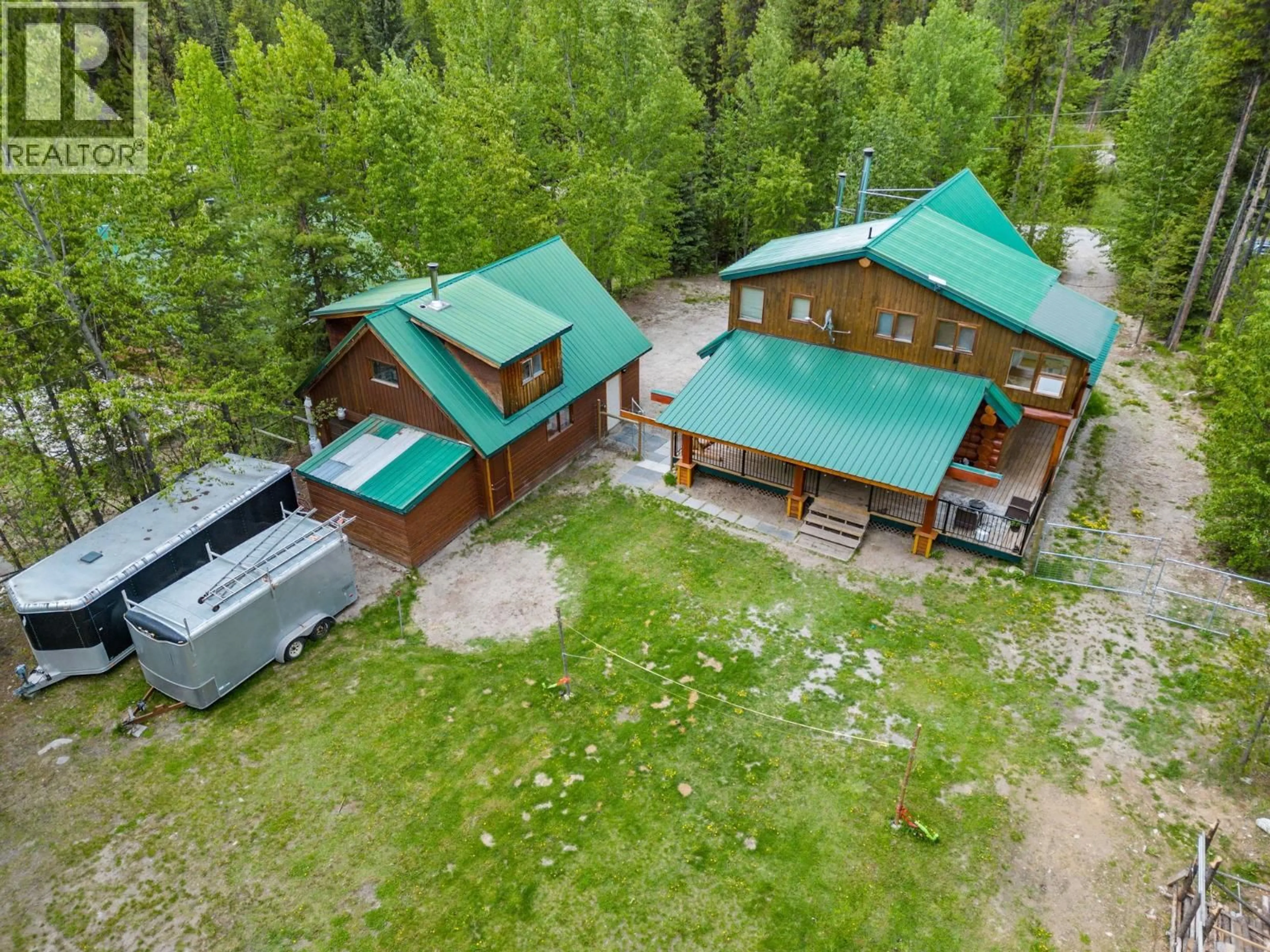 A pic from outside/outdoor area/front of a property/back of a property/a pic from drone, unknown for 9360 SUNRISE PLACE, Idabel Lake British Columbia V1P1P4