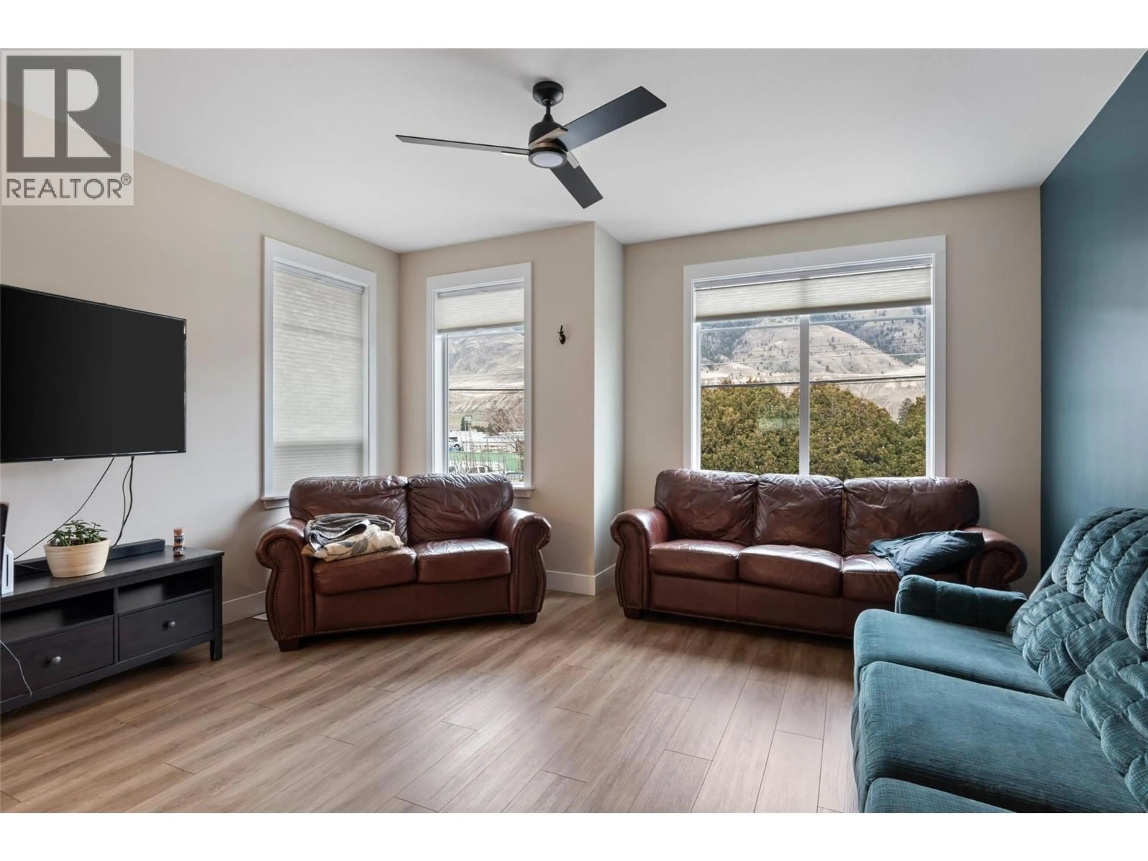 Living room with furniture, wood/laminate floor for 2535 SUNSET DRIVE, Kamloops British Columbia V2C4K1