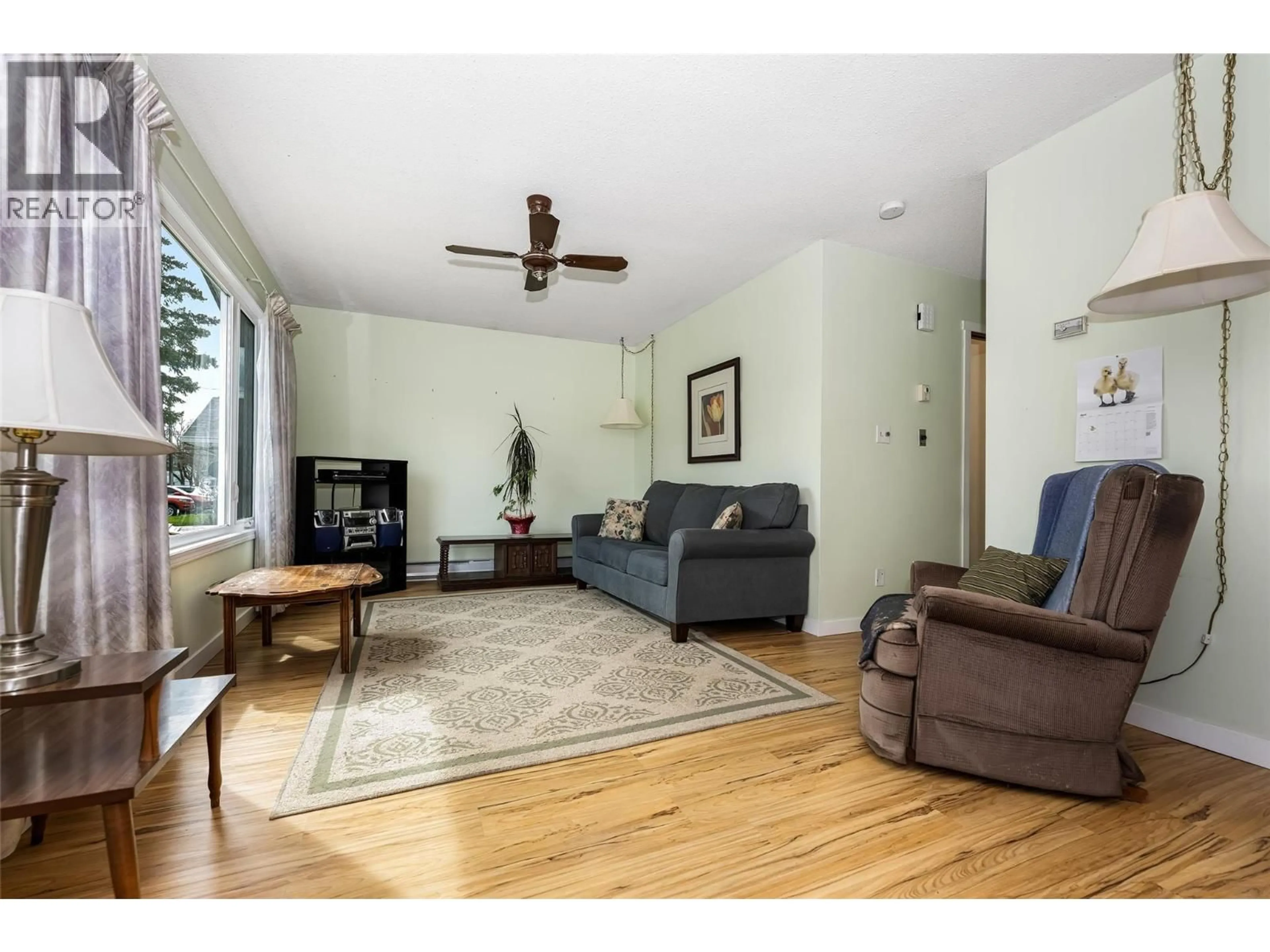 Living room with furniture, wood/laminate floor for 3341 BELAIRE DRIVE, Armstrong British Columbia V4Y0K1