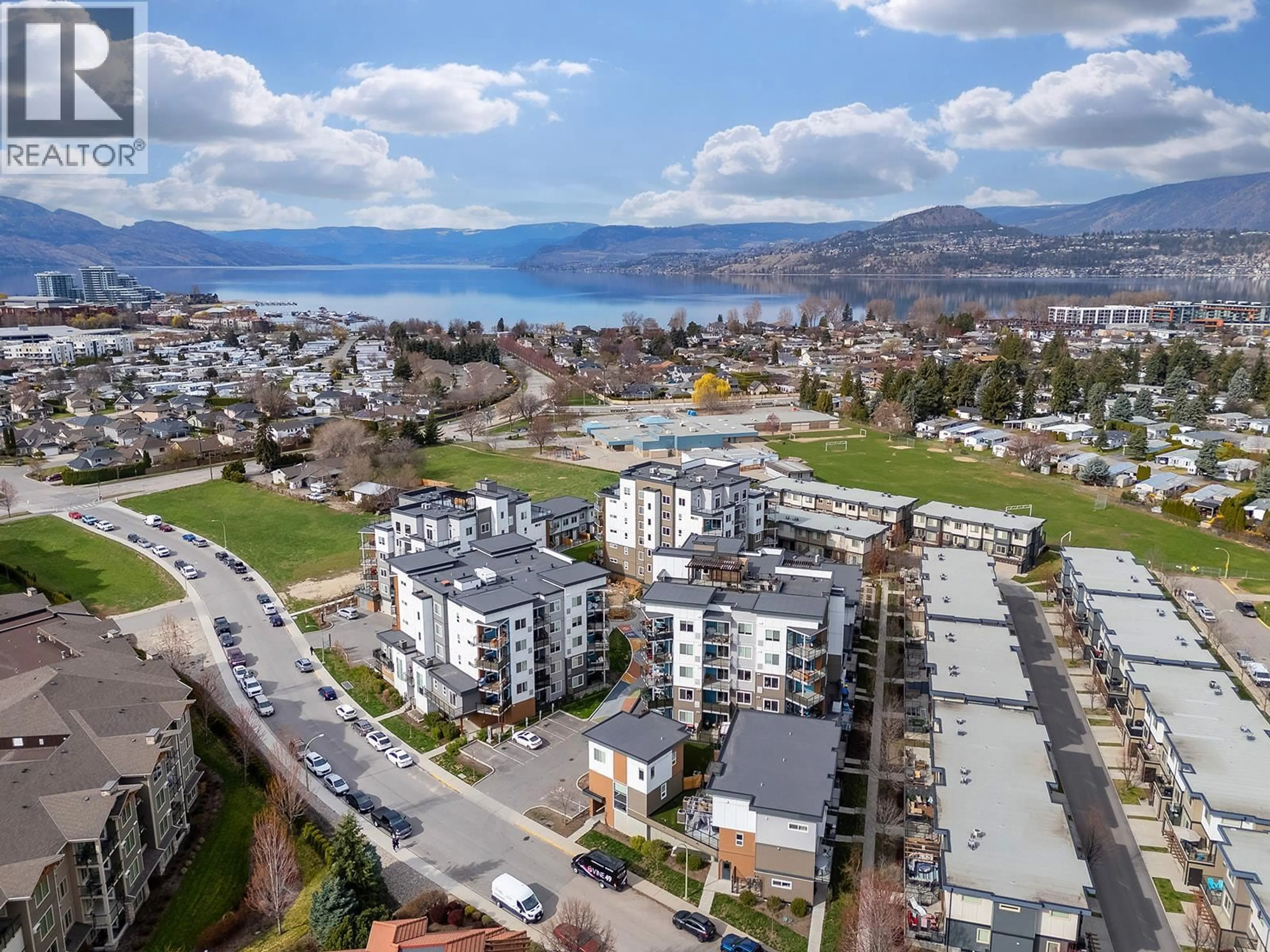 A pic from outside/outdoor area/front of a property/back of a property/a pic from drone, mountain view for 104 - 3638 MISSION SPRINGS DRIVE, Kelowna British Columbia V1W0B3