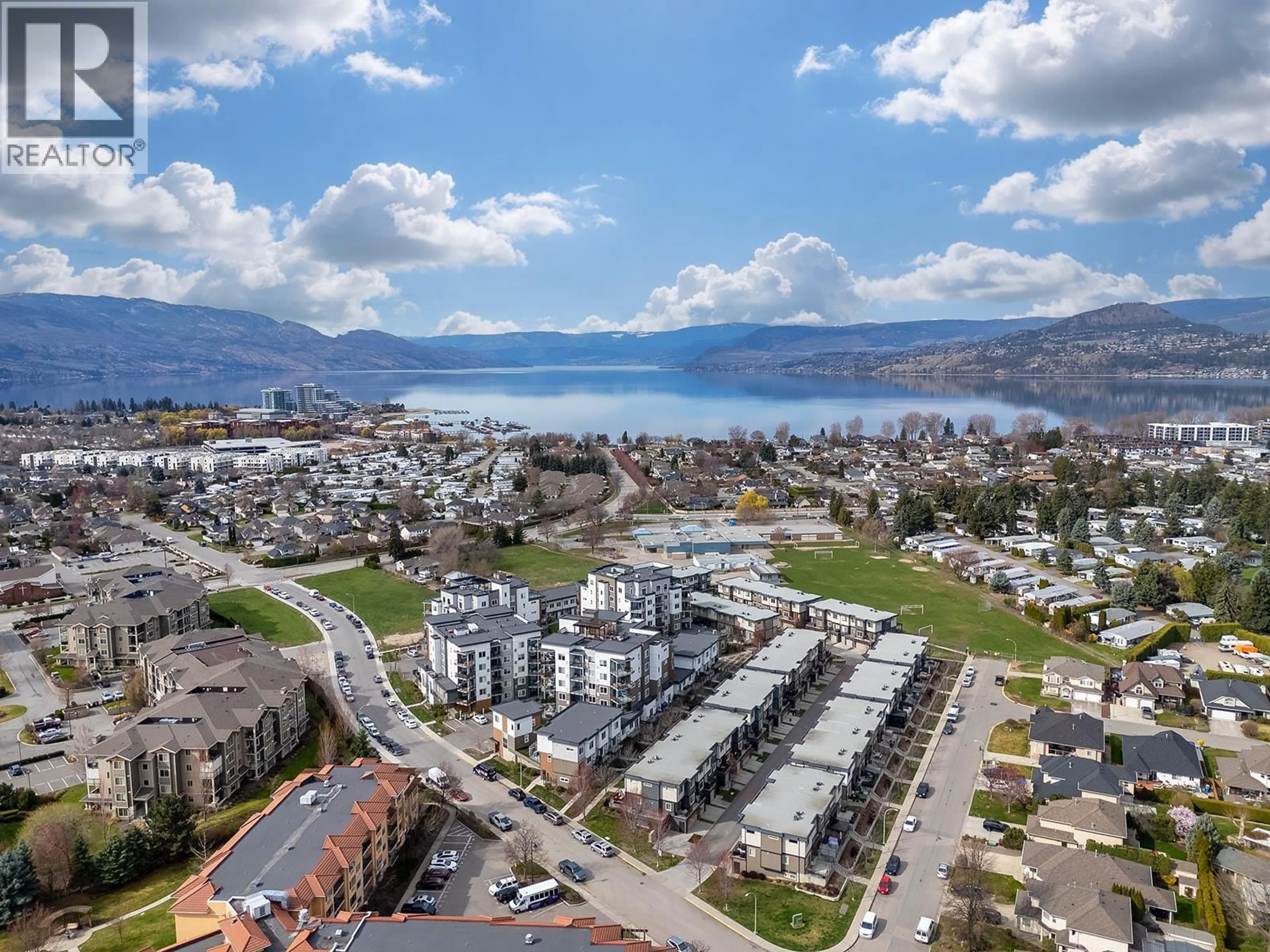 A pic from outside/outdoor area/front of a property/back of a property/a pic from drone, mountain view for 104 - 3638 MISSION SPRINGS DRIVE, Kelowna British Columbia V1W0B3