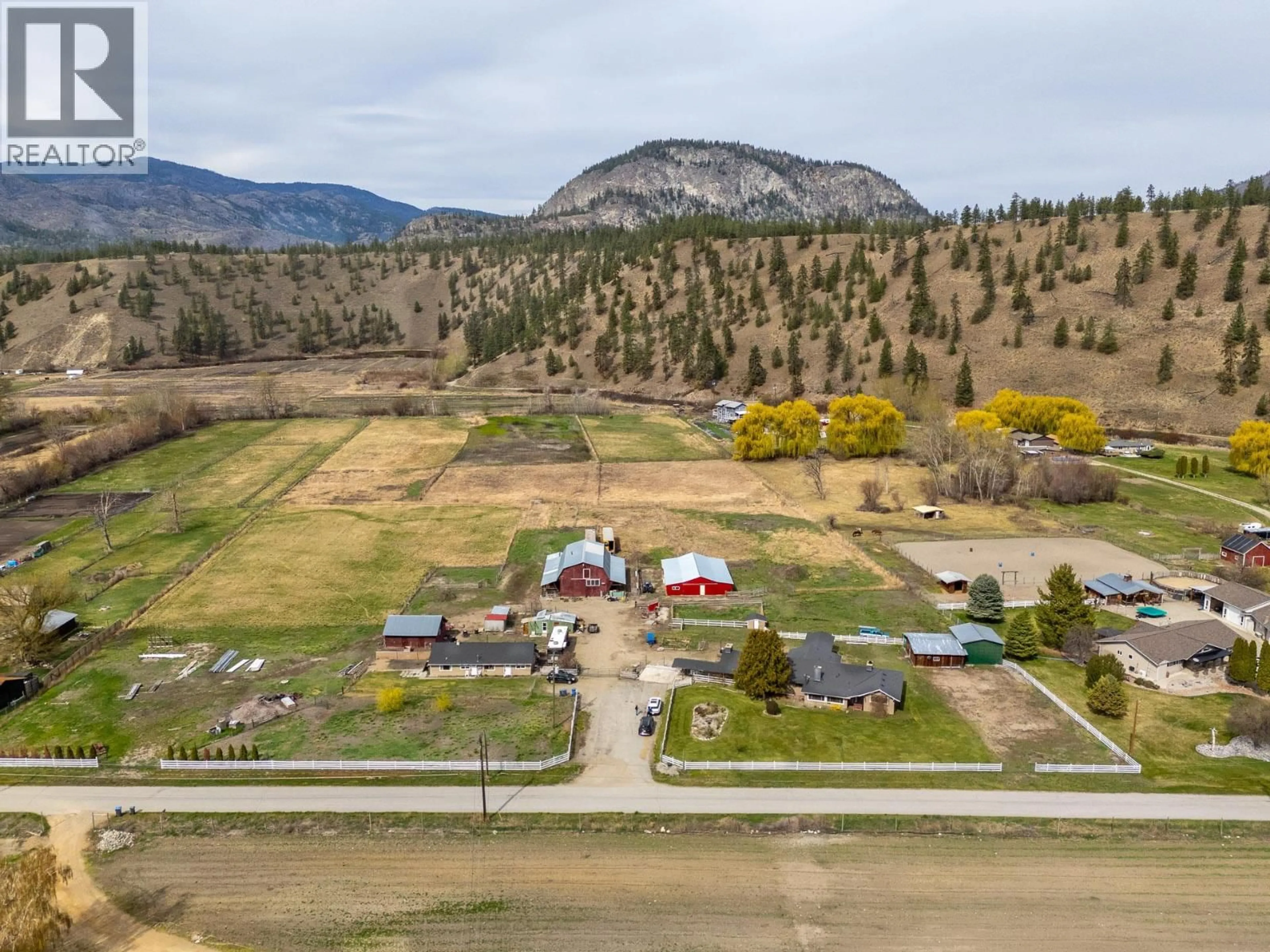 A pic from outside/outdoor area/front of a property/back of a property/a pic from drone, mountain view for 8134 RIVER ROAD, Oliver British Columbia V0H1T7