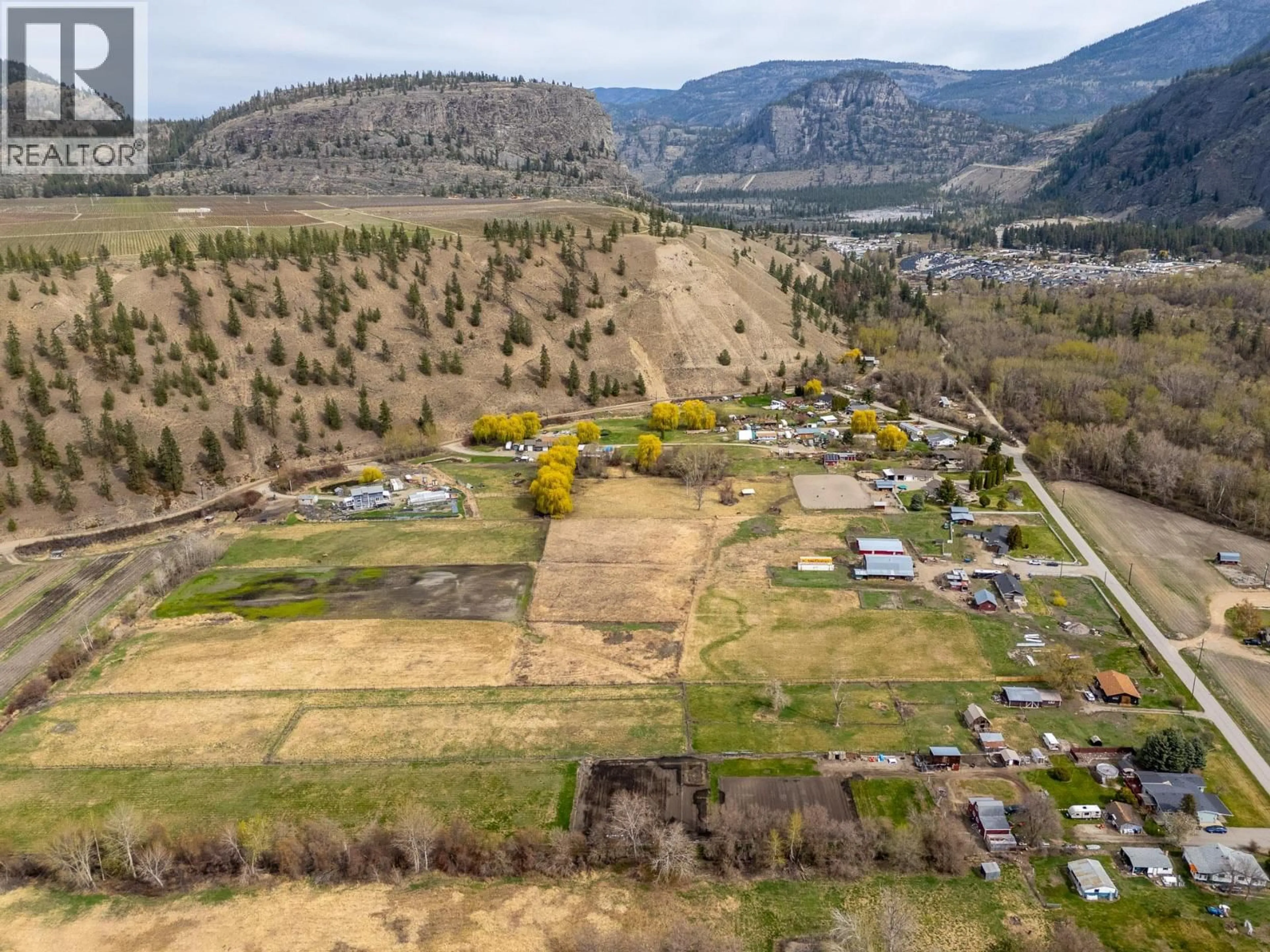A pic from outside/outdoor area/front of a property/back of a property/a pic from drone, mountain view for 8134 RIVER ROAD, Oliver British Columbia V0H1T7