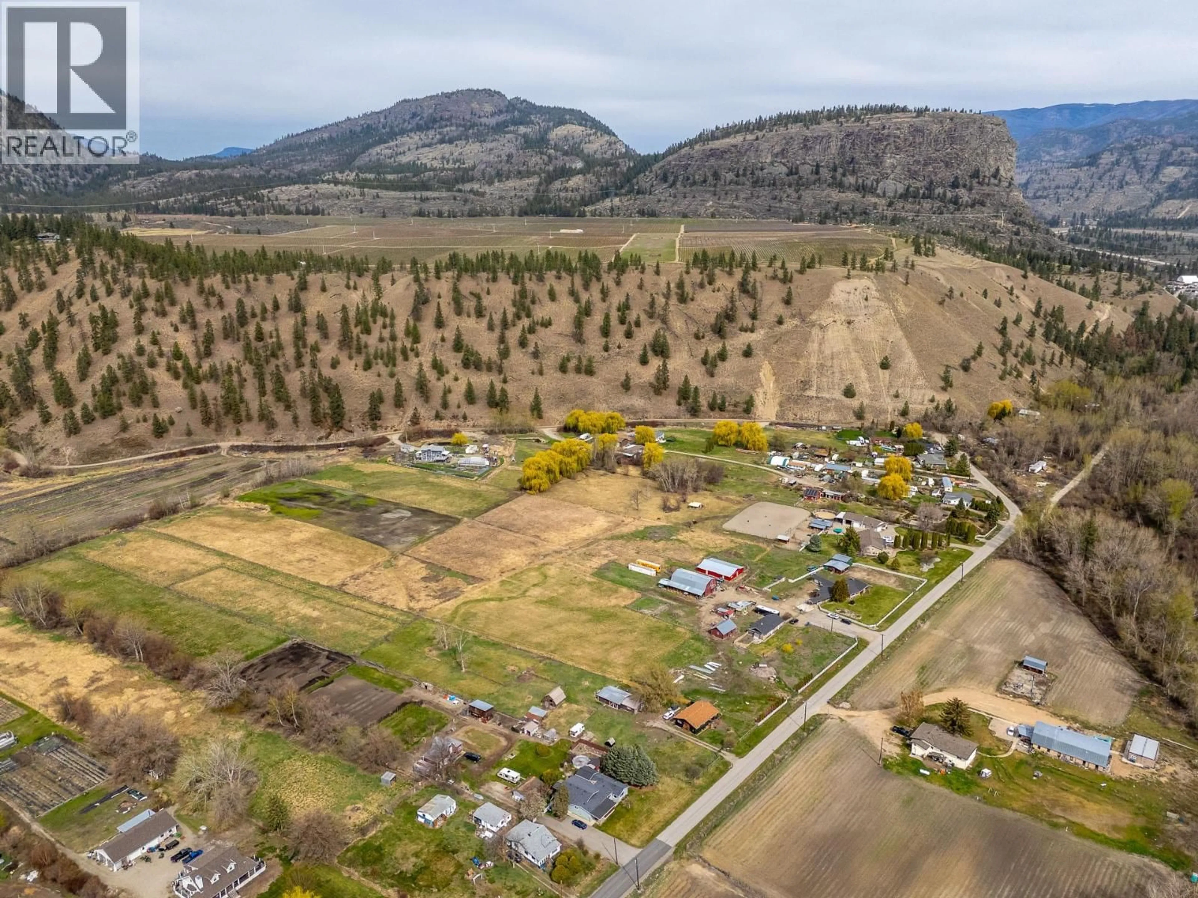 A pic from outside/outdoor area/front of a property/back of a property/a pic from drone, mountain view for 8134 RIVER ROAD, Oliver British Columbia V0H1T7