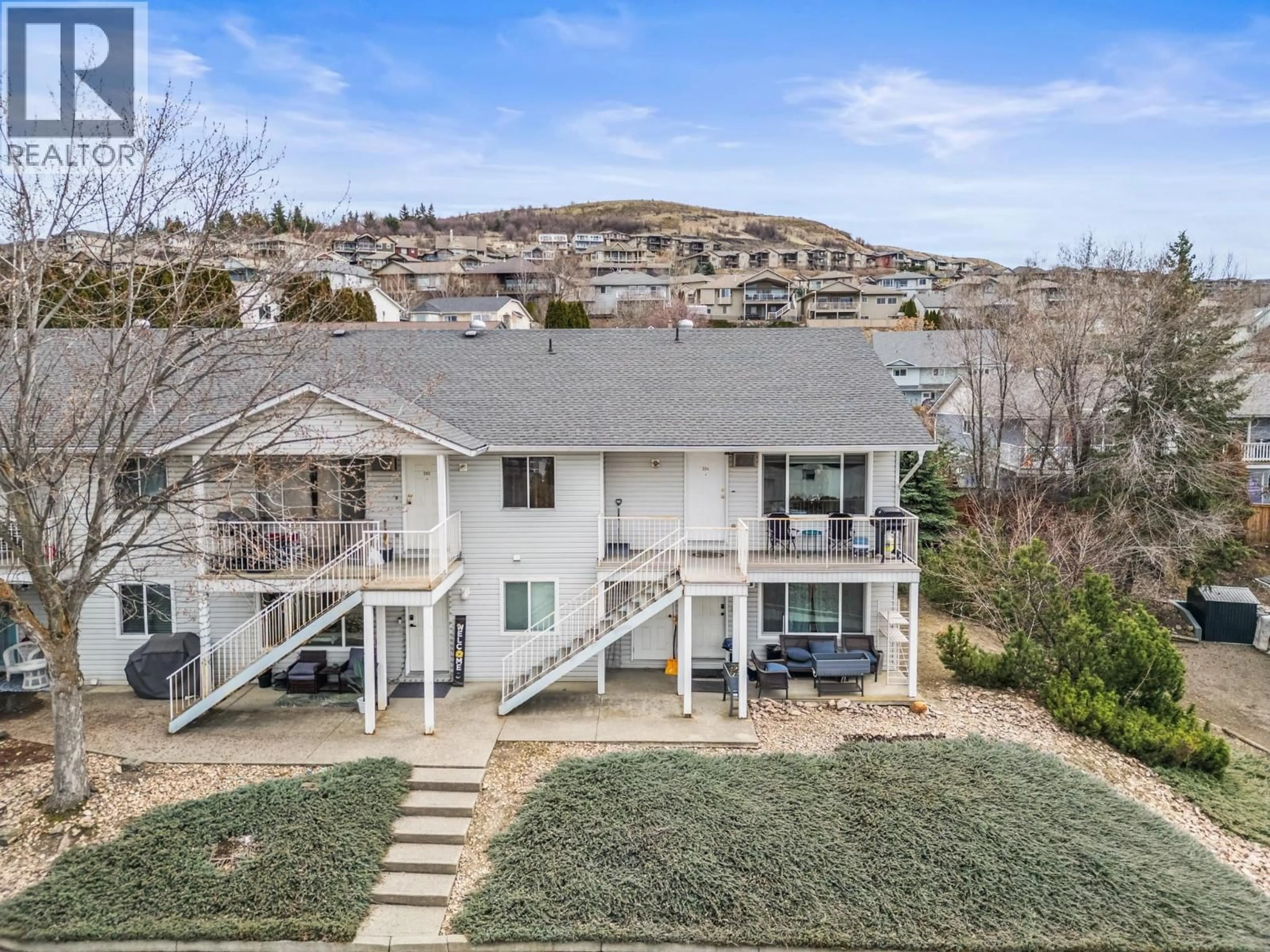 A pic from outside/outdoor area/front of a property/back of a property/a pic from drone, mountain view for 204 - 1041 MIDDLETON WAY, Vernon British Columbia V1B2N3