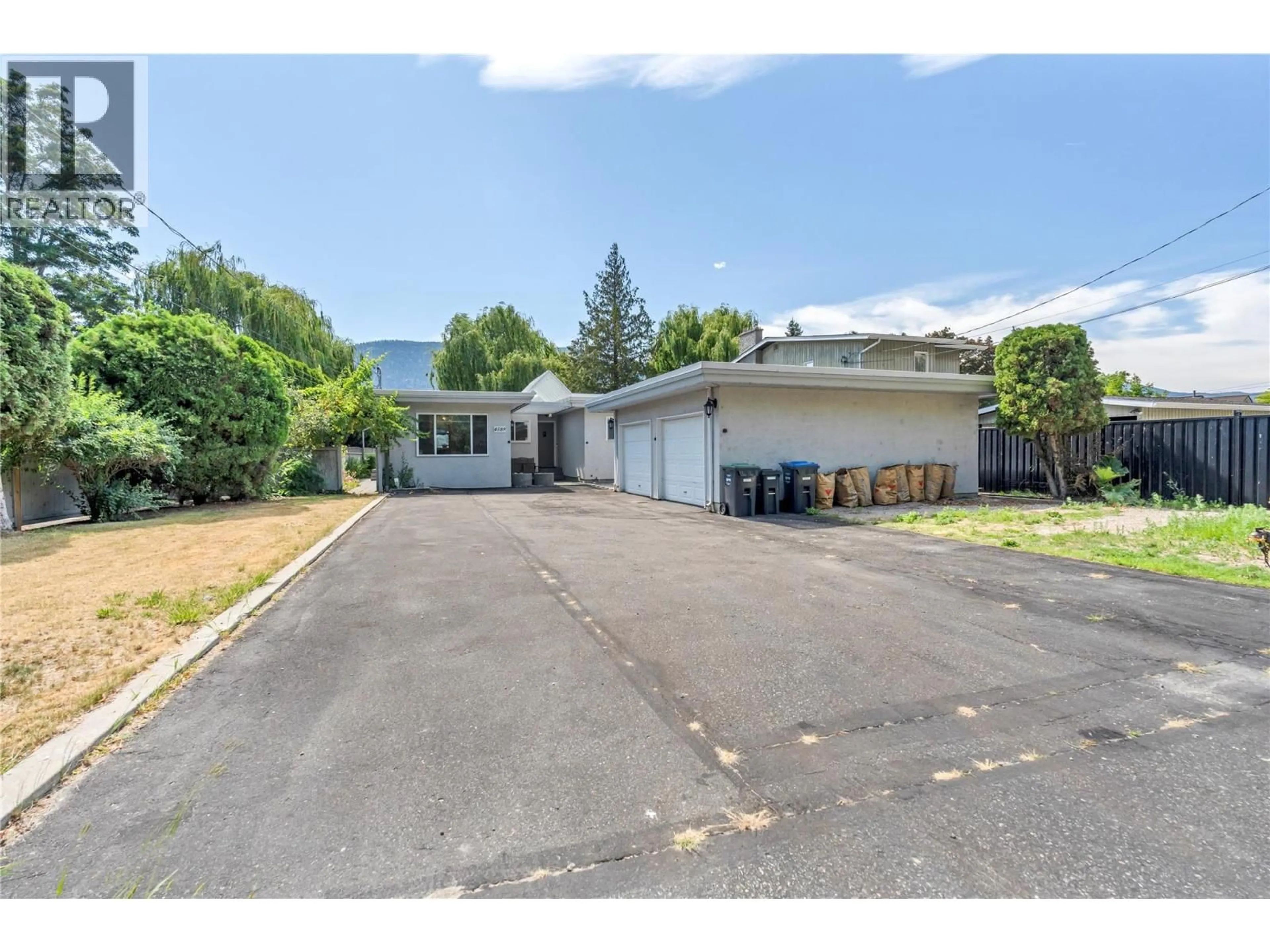 A pic from outside/outdoor area/front of a property/back of a property/a pic from drone, street for 4589 LAKESIDE ROAD, Penticton British Columbia V2A8W4