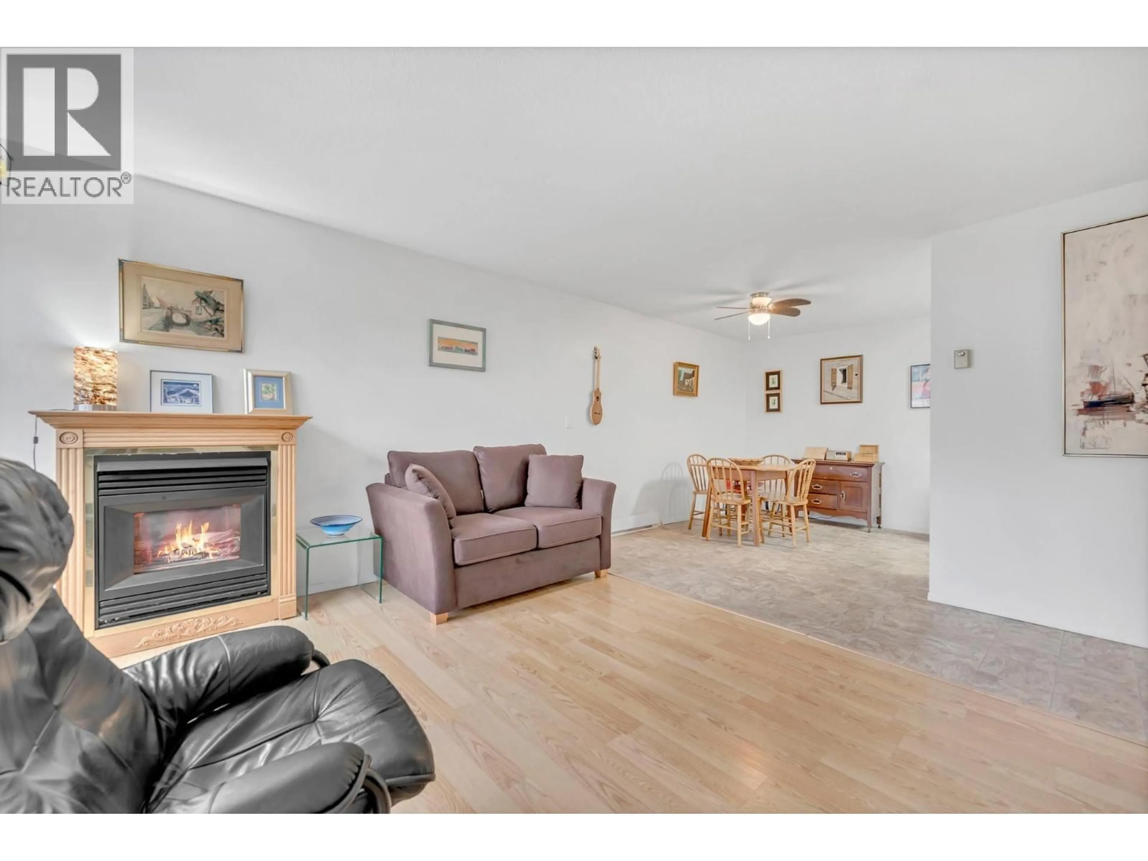 Living room with furniture, wood/laminate floor for 104 - 703 GRANVILLE AVENUE, Enderby British Columbia V0E1V0