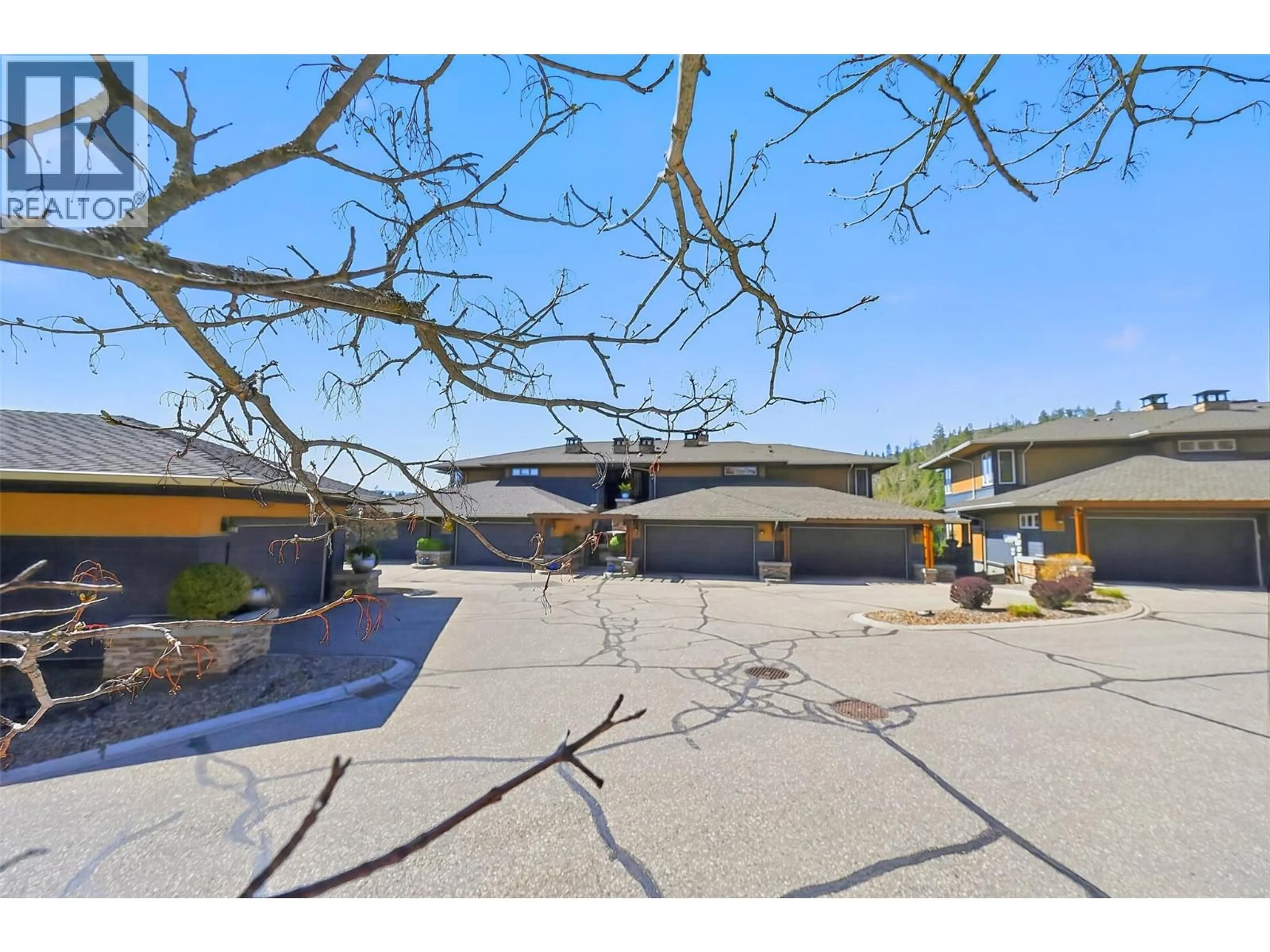 A pic from outside/outdoor area/front of a property/back of a property/a pic from drone, street for 4 - 101 FALCON POINT WAY, Vernon British Columbia V1H1V4