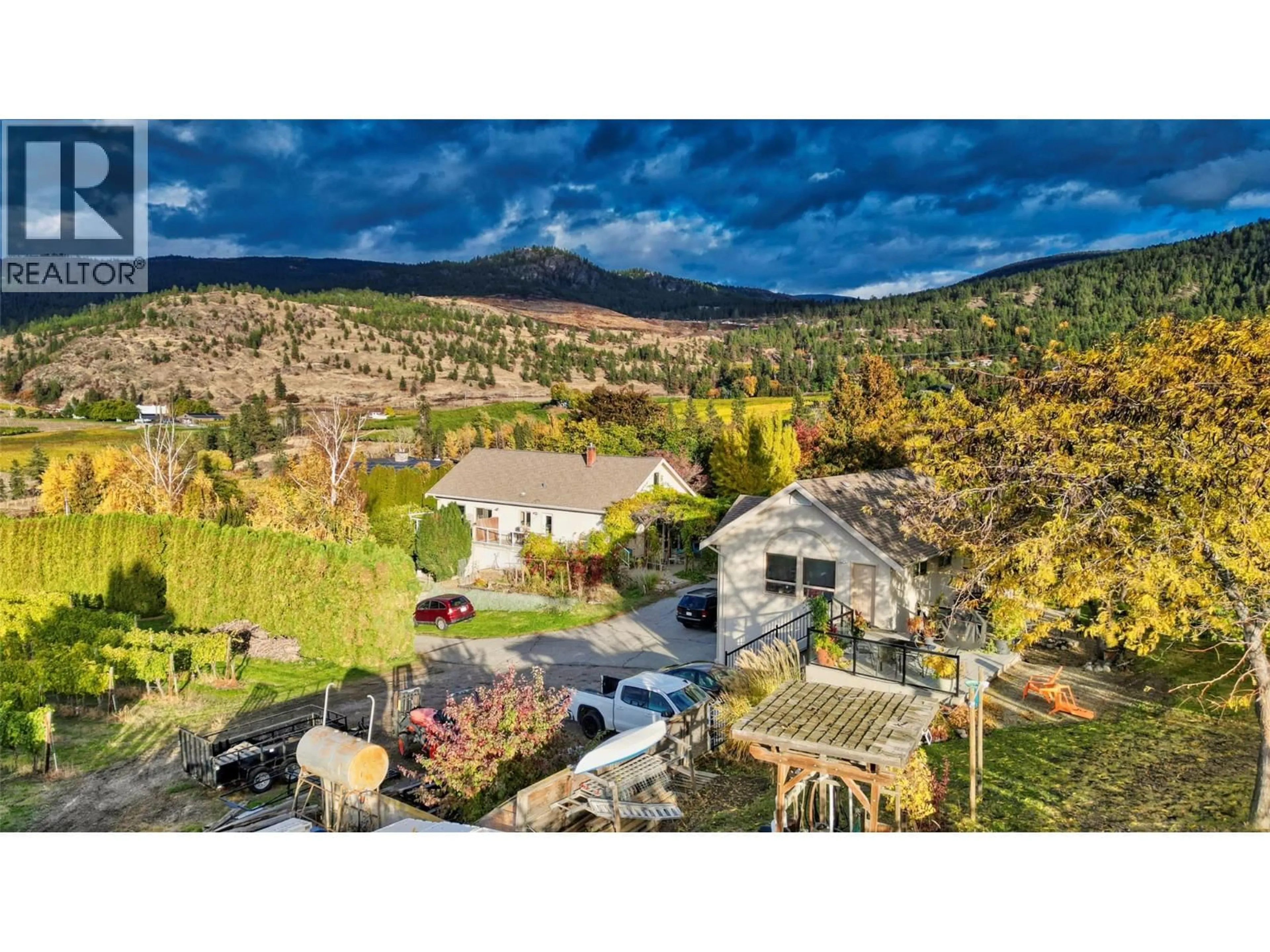 A pic from outside/outdoor area/front of a property/back of a property/a pic from drone, mountain view for 1282 CORBISHLEY AVENUE, Penticton British Columbia V2A8V2