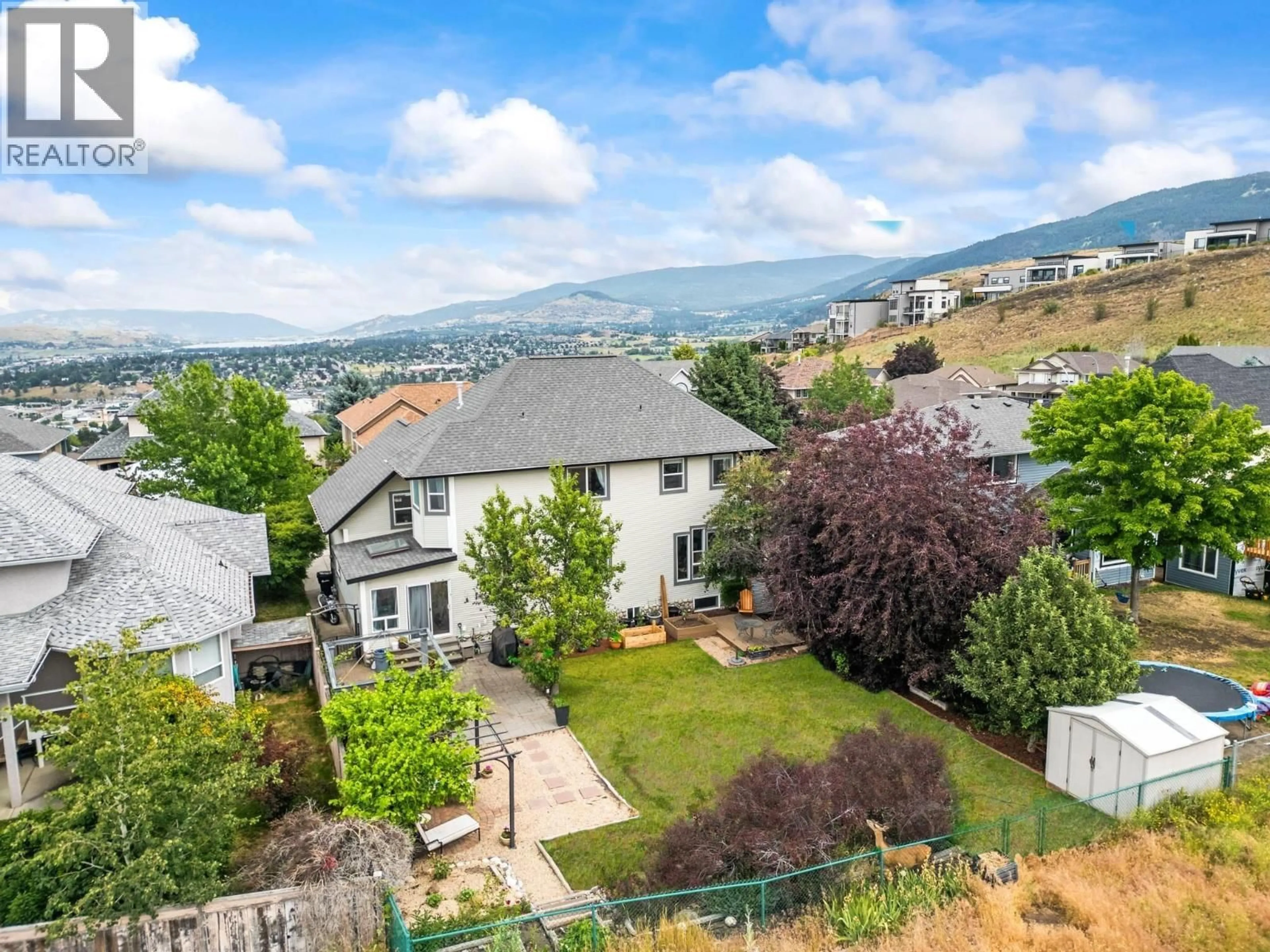 A pic from outside/outdoor area/front of a property/back of a property/a pic from drone, mountain view for 859 MT. BULMAN PLACE, Vernon British Columbia V1B2Z3