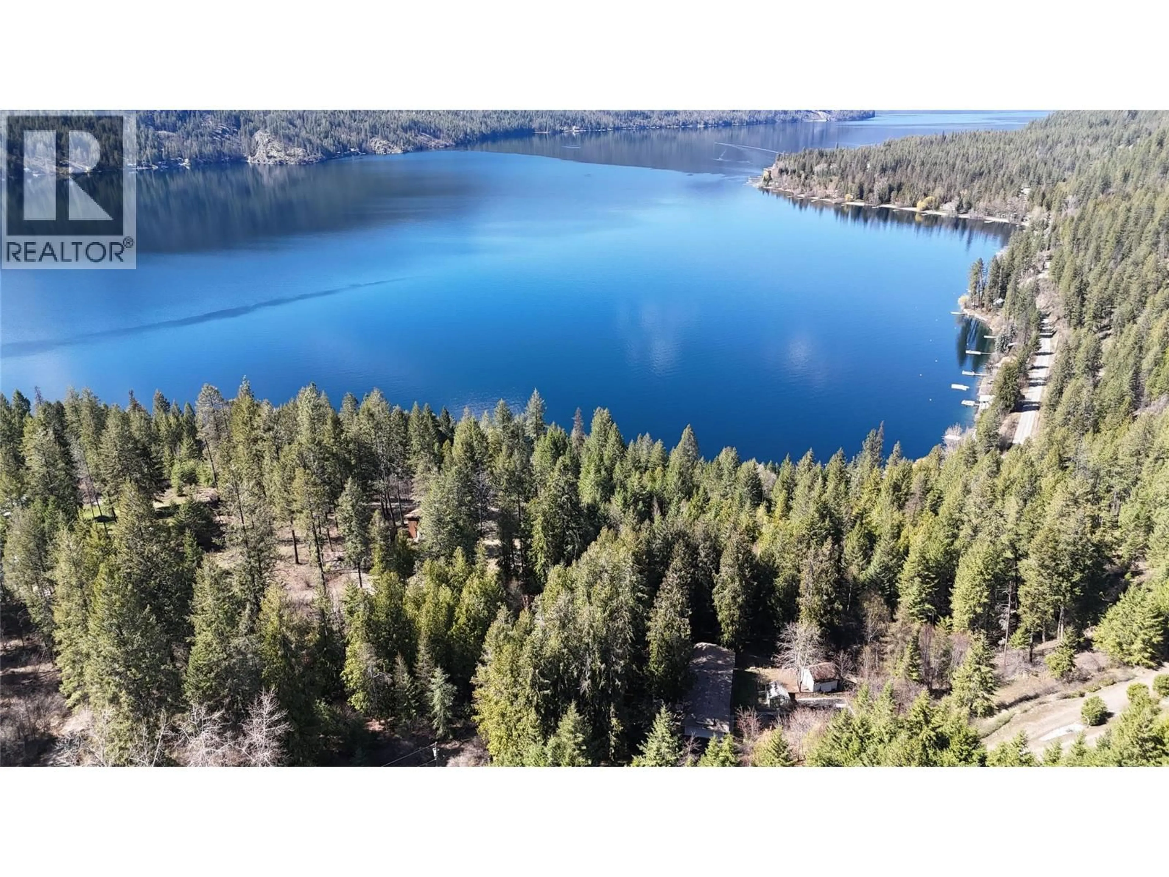 A pic from outside/outdoor area/front of a property/back of a property/a pic from drone, water/lake/river/ocean view for 3150 HAMA ROAD, Christina Lake British Columbia V0H1E0