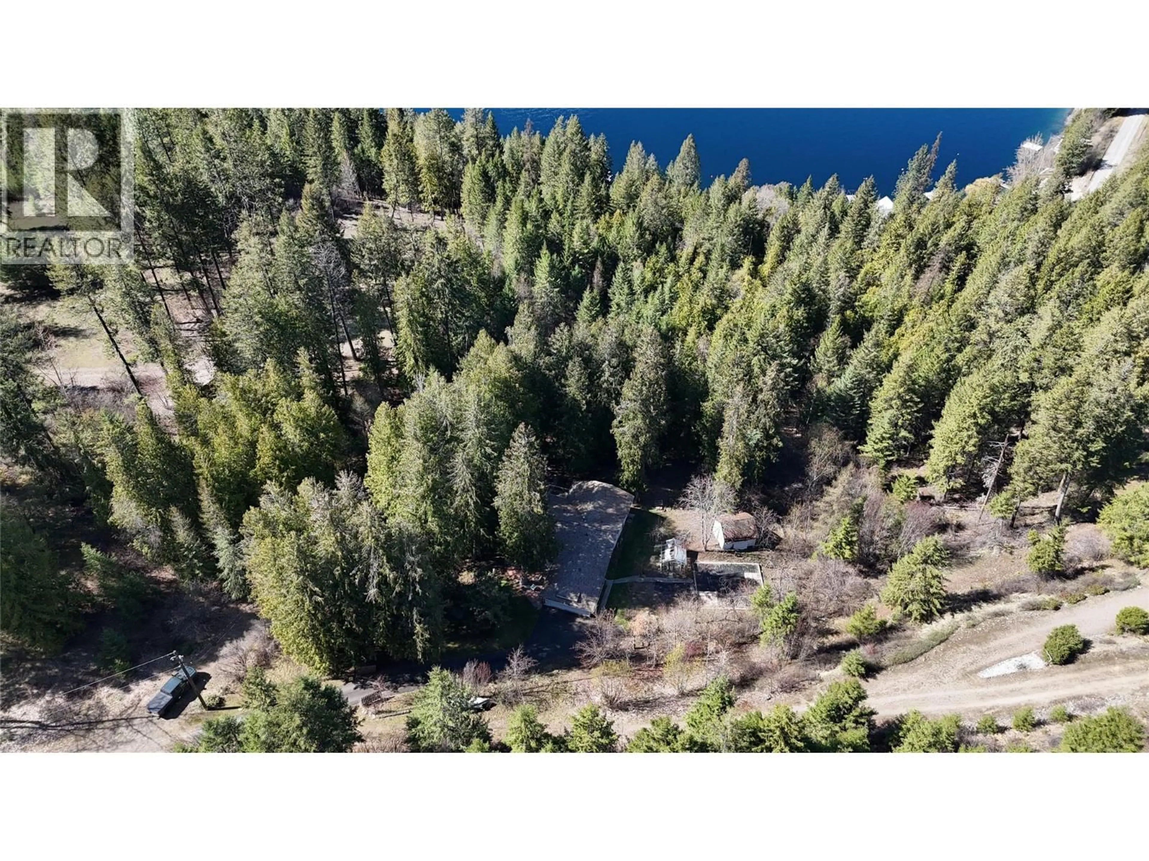 A pic from outside/outdoor area/front of a property/back of a property/a pic from drone, forest/trees view for 3150 HAMA ROAD, Christina Lake British Columbia V0H1E0