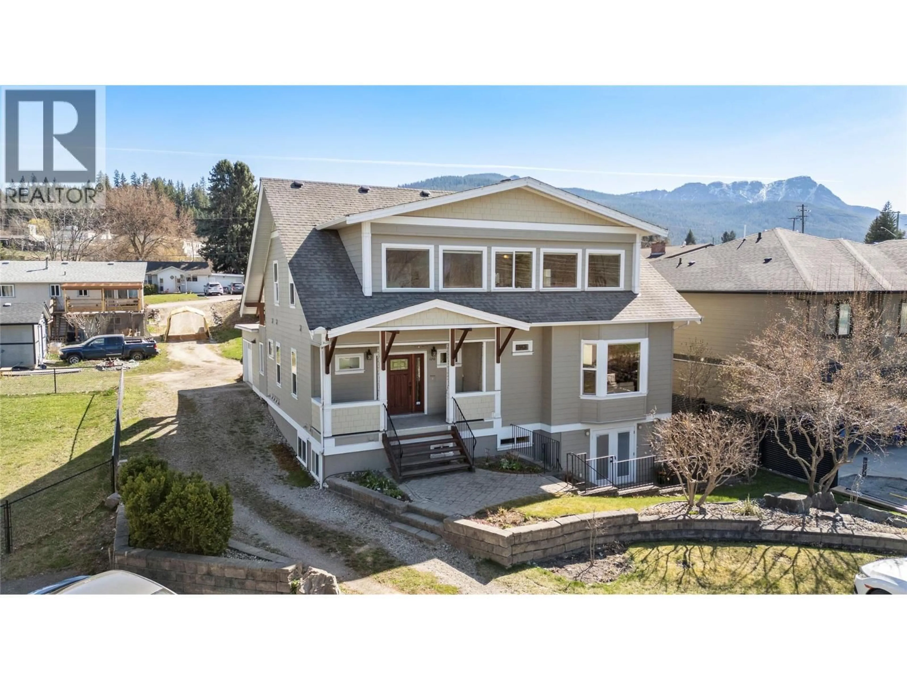 A pic from outside/outdoor area/front of a property/back of a property/a pic from drone, mountain view for 1050 9 AVENUE NORTHEAST, Salmon Arm British Columbia V1E4A8