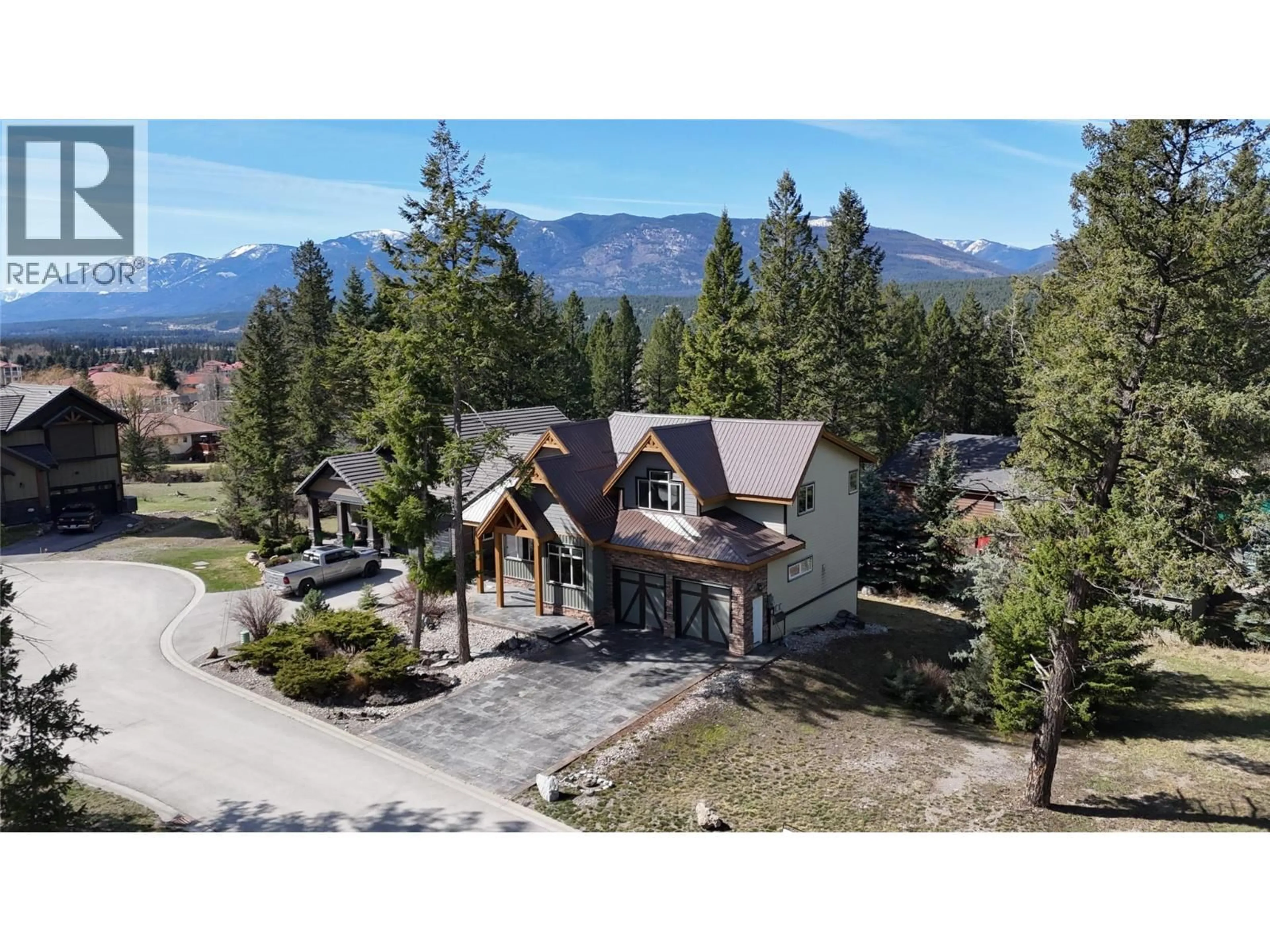 A pic from outside/outdoor area/front of a property/back of a property/a pic from drone, mountain view for 4997 EAGLEBROOK COURT, Fairmont Hot Springs British Columbia V0B1L1