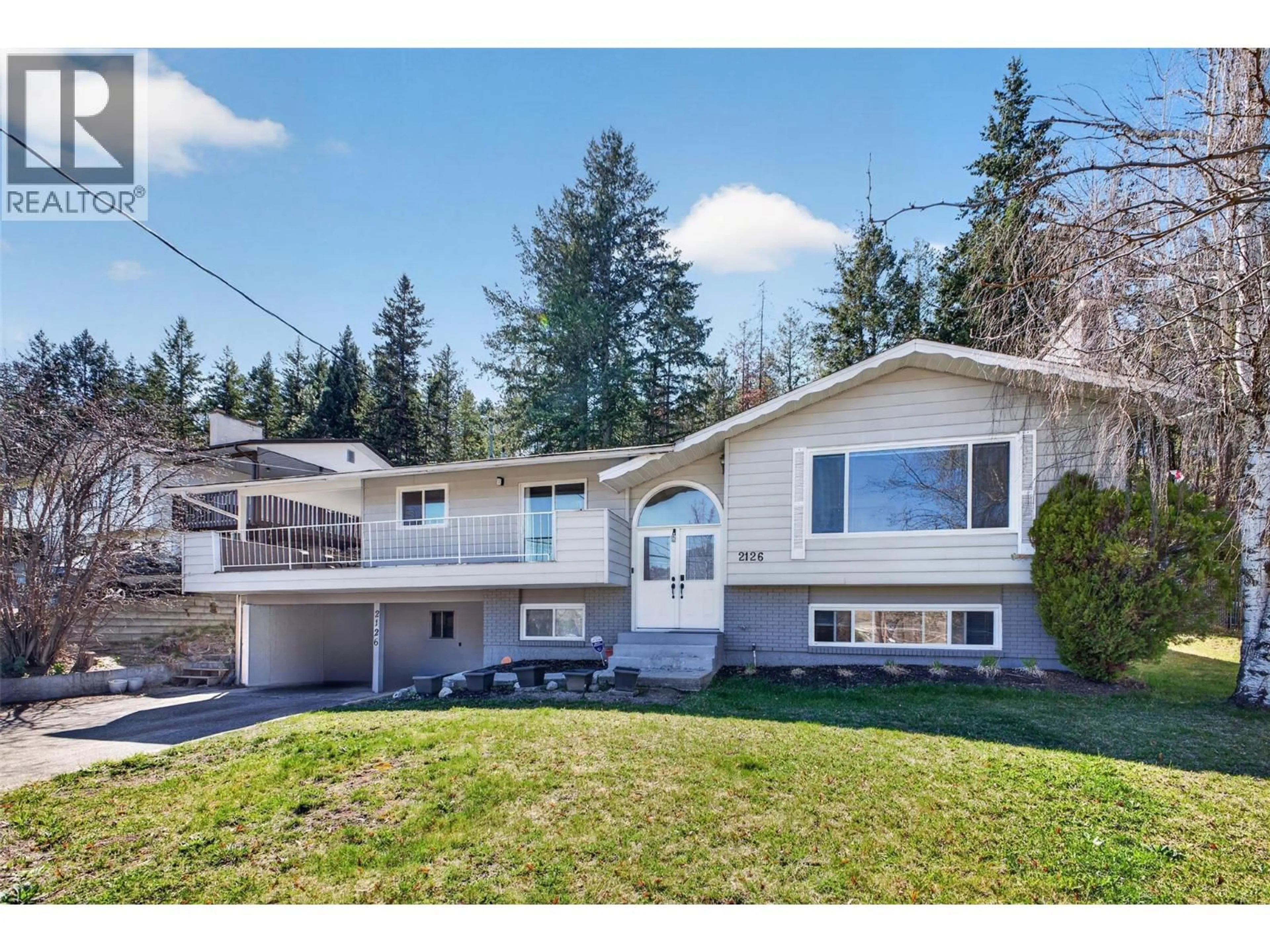 Home with vinyl exterior material, street for 2126 VERDE VISTA ROAD, Kelowna British Columbia V1P1G5