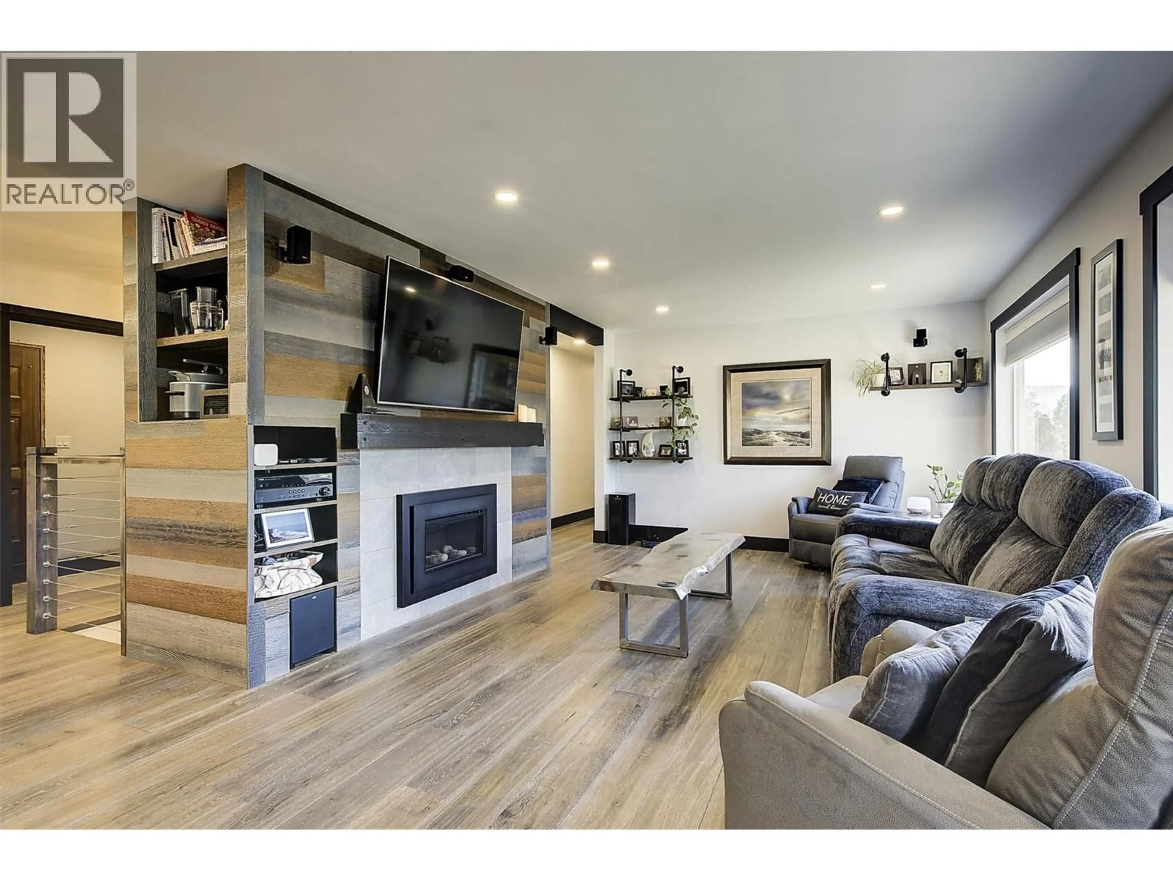 Living room with furniture, wood/laminate floor for 2094 TOMAT AVENUE, West Kelowna British Columbia V1Z3J2