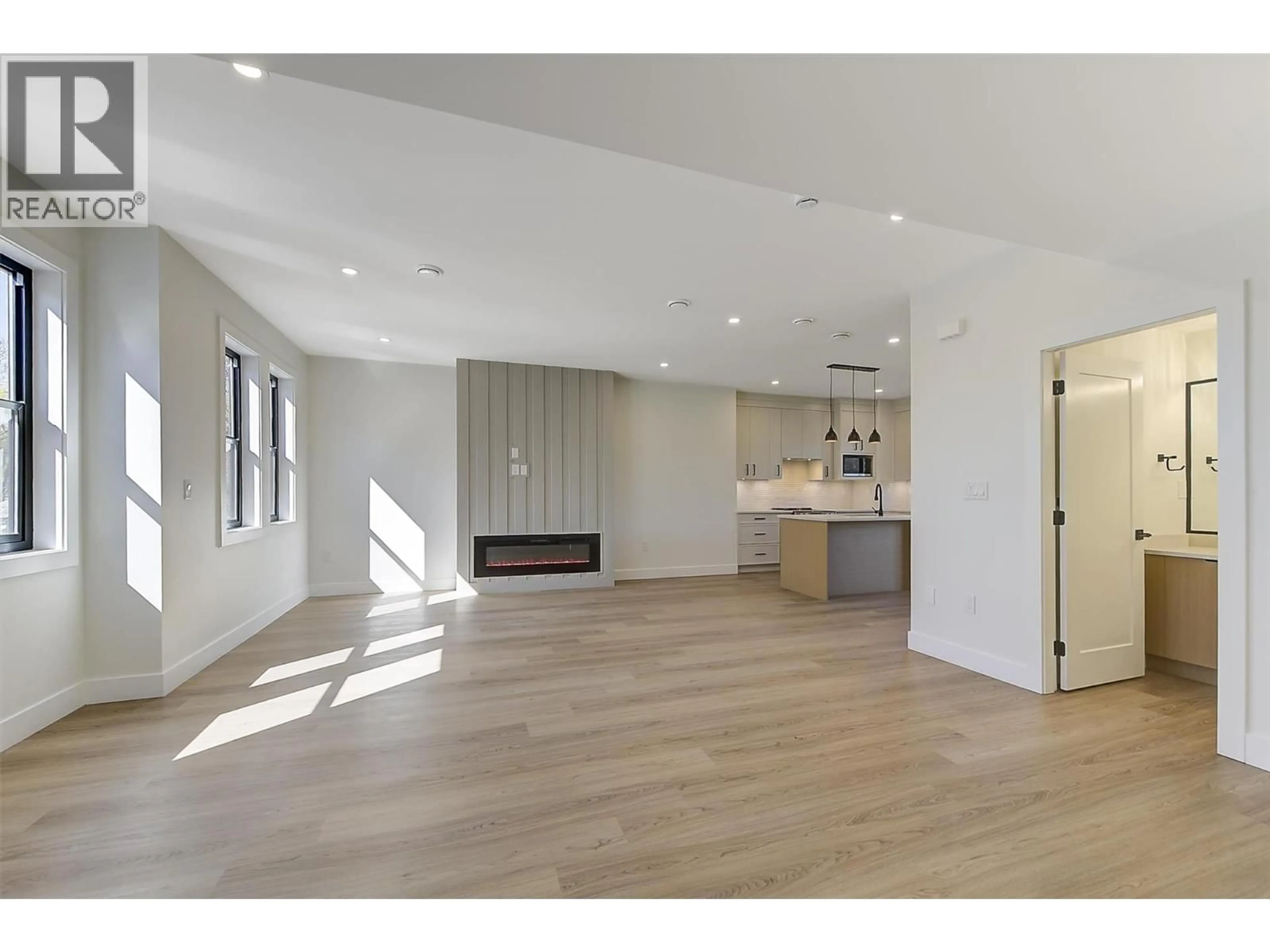 Open concept kitchen, wood/laminate floor for 4 - 3590 REDECOPP ROAD, Lake Country British Columbia V4V1X5