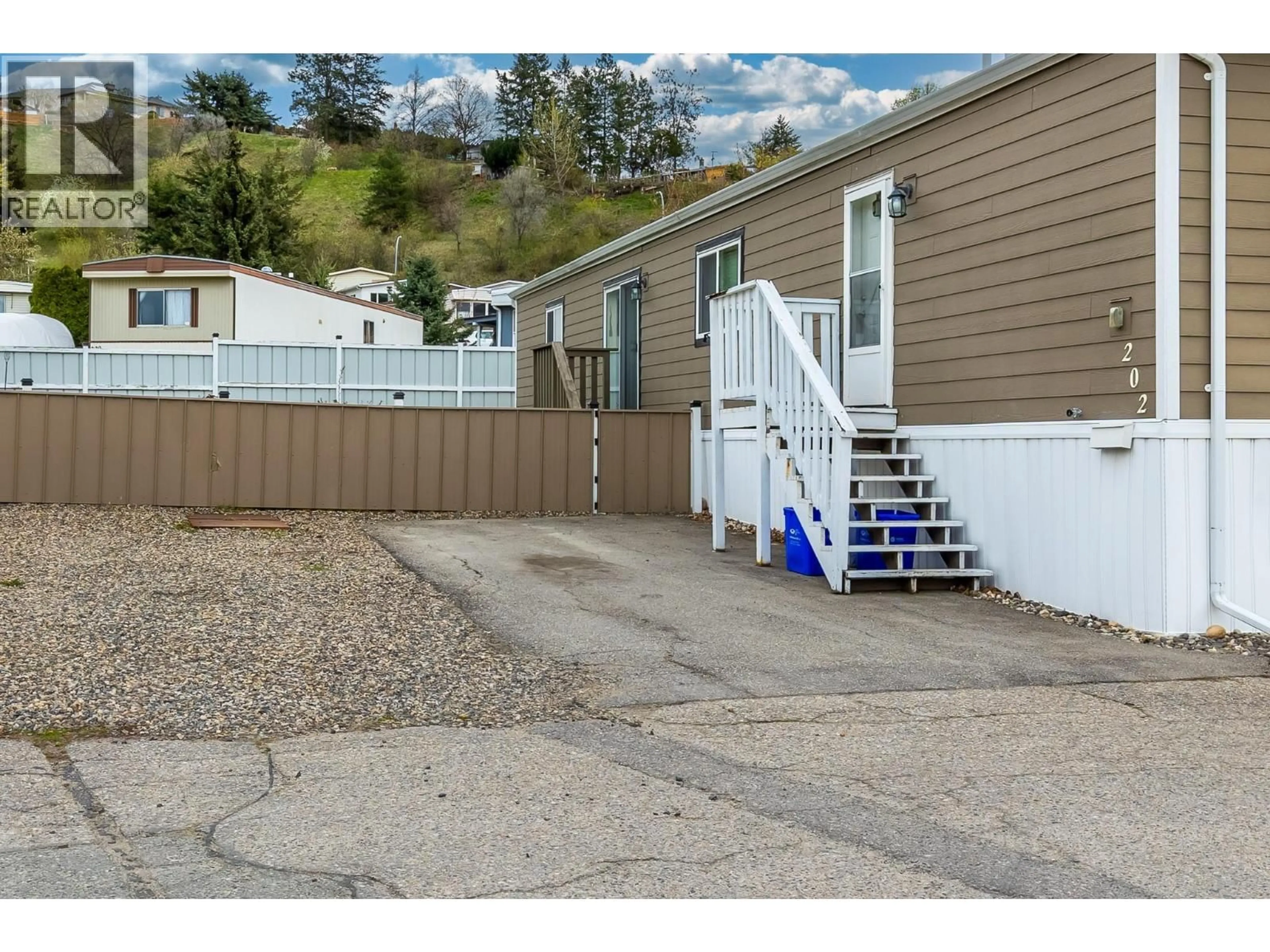 Home with vinyl exterior material, mountain view for 202 - 15401 KALAMALKA ROAD, Coldstream British Columbia V1B1Z3