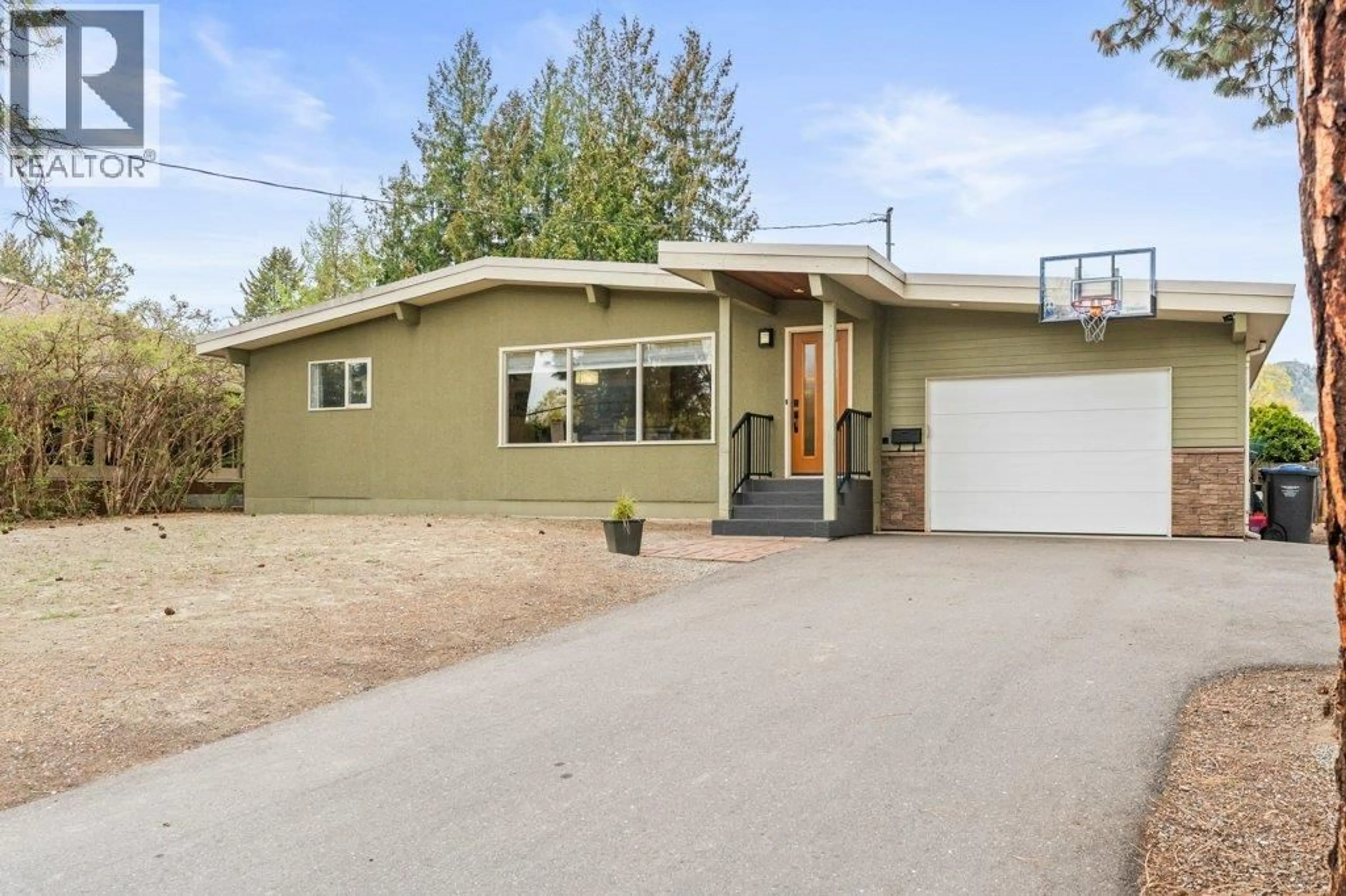 Home with vinyl exterior material, street for 1784 HIGHLAND DRIVE NORTH, Kelowna British Columbia V1Y4L2