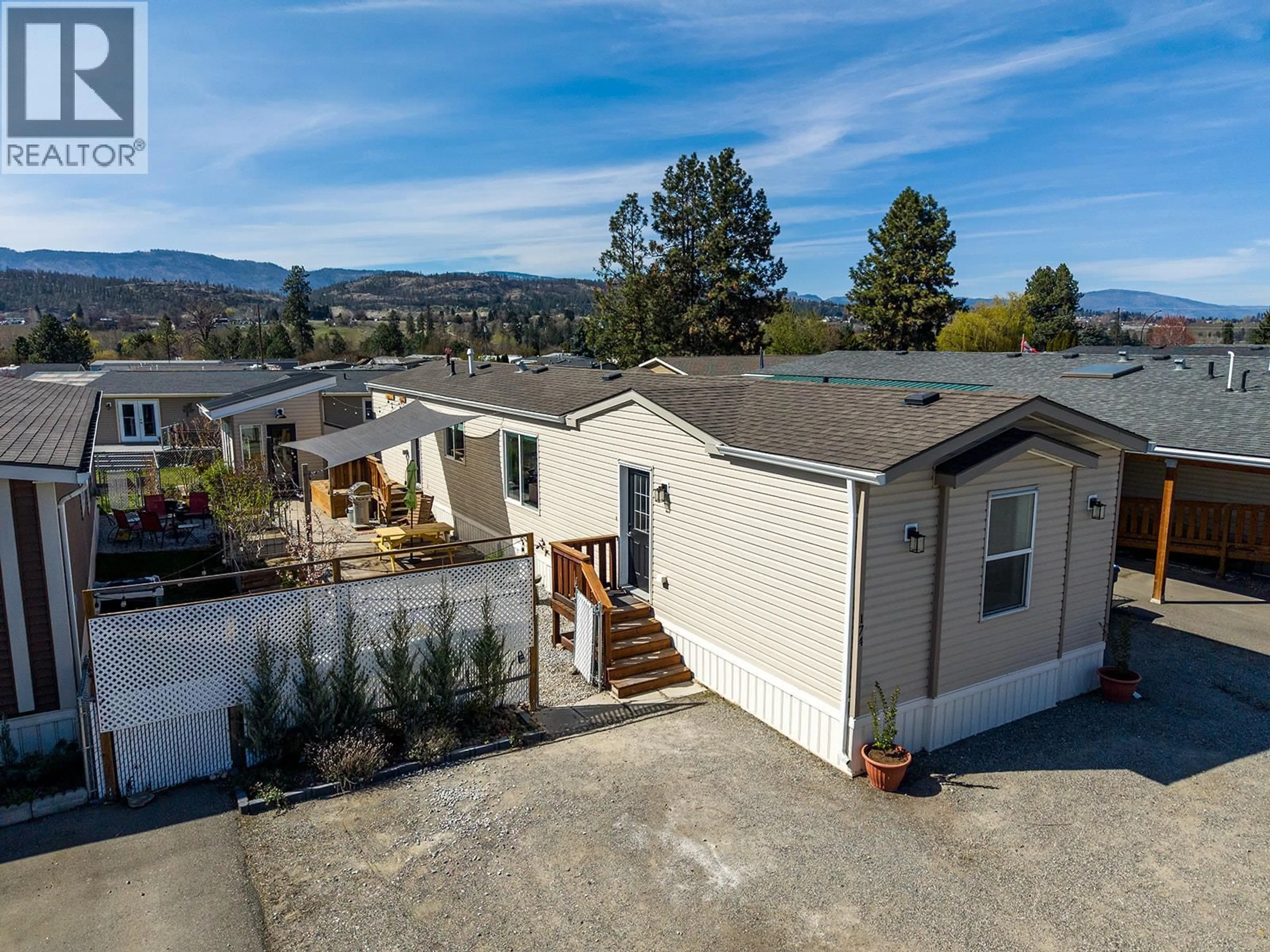 A pic from outside/outdoor area/front of a property/back of a property/a pic from drone, mountain view for 174 - 9020 JIM BAILEY ROAD, Kelowna British Columbia V4V1E5