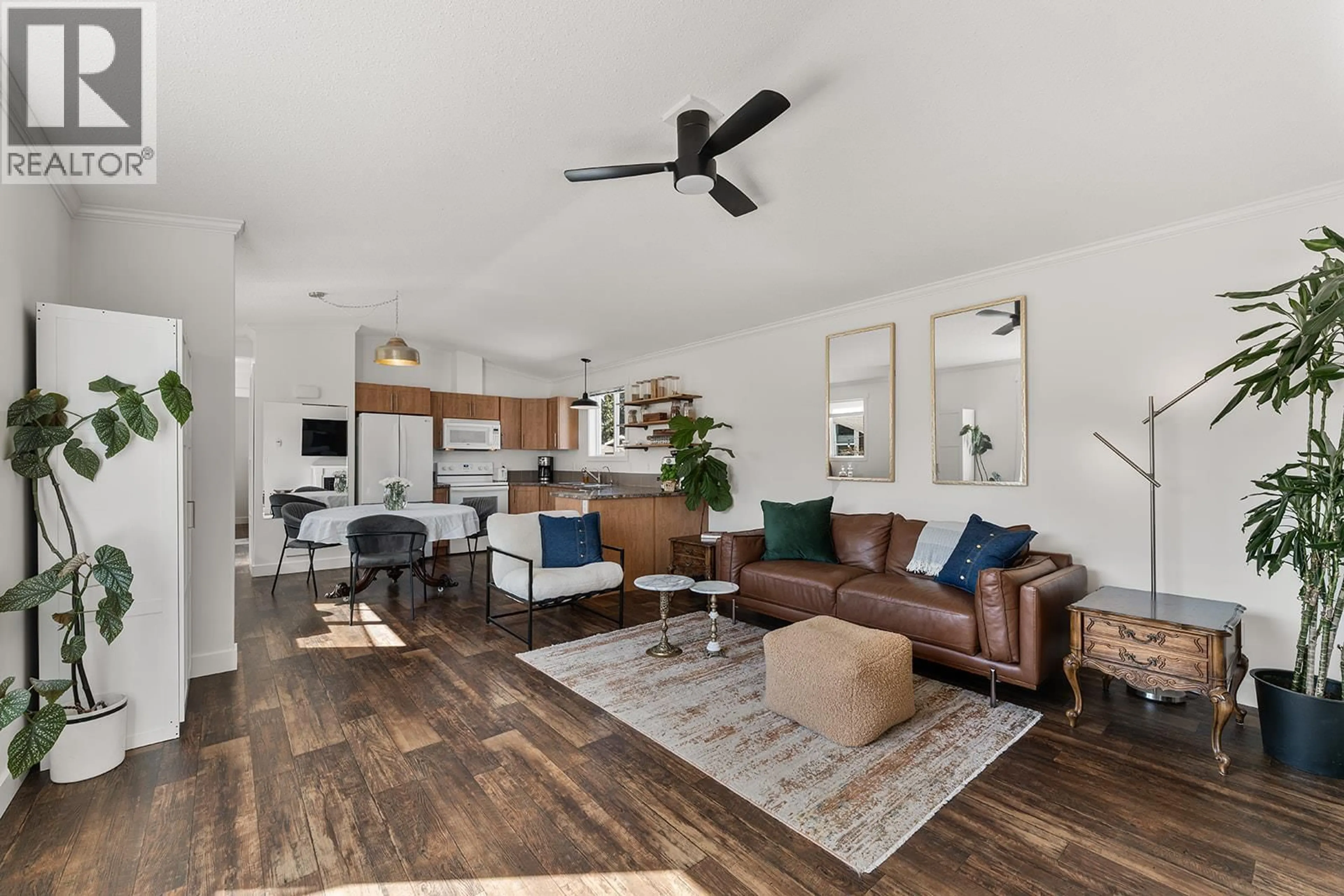 Living room with furniture, wood/laminate floor for 174 - 9020 JIM BAILEY ROAD, Kelowna British Columbia V4V1E5