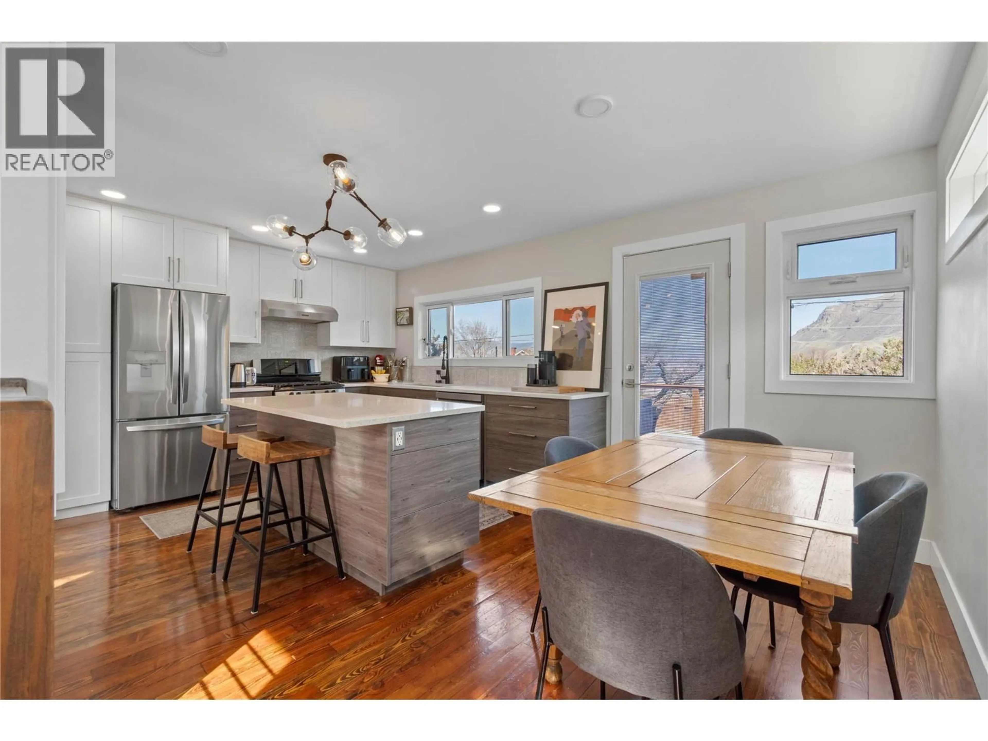 Open concept kitchen, wood/laminate floor for 1054 DOMINION STREET, Kamloops British Columbia V2C2Y5