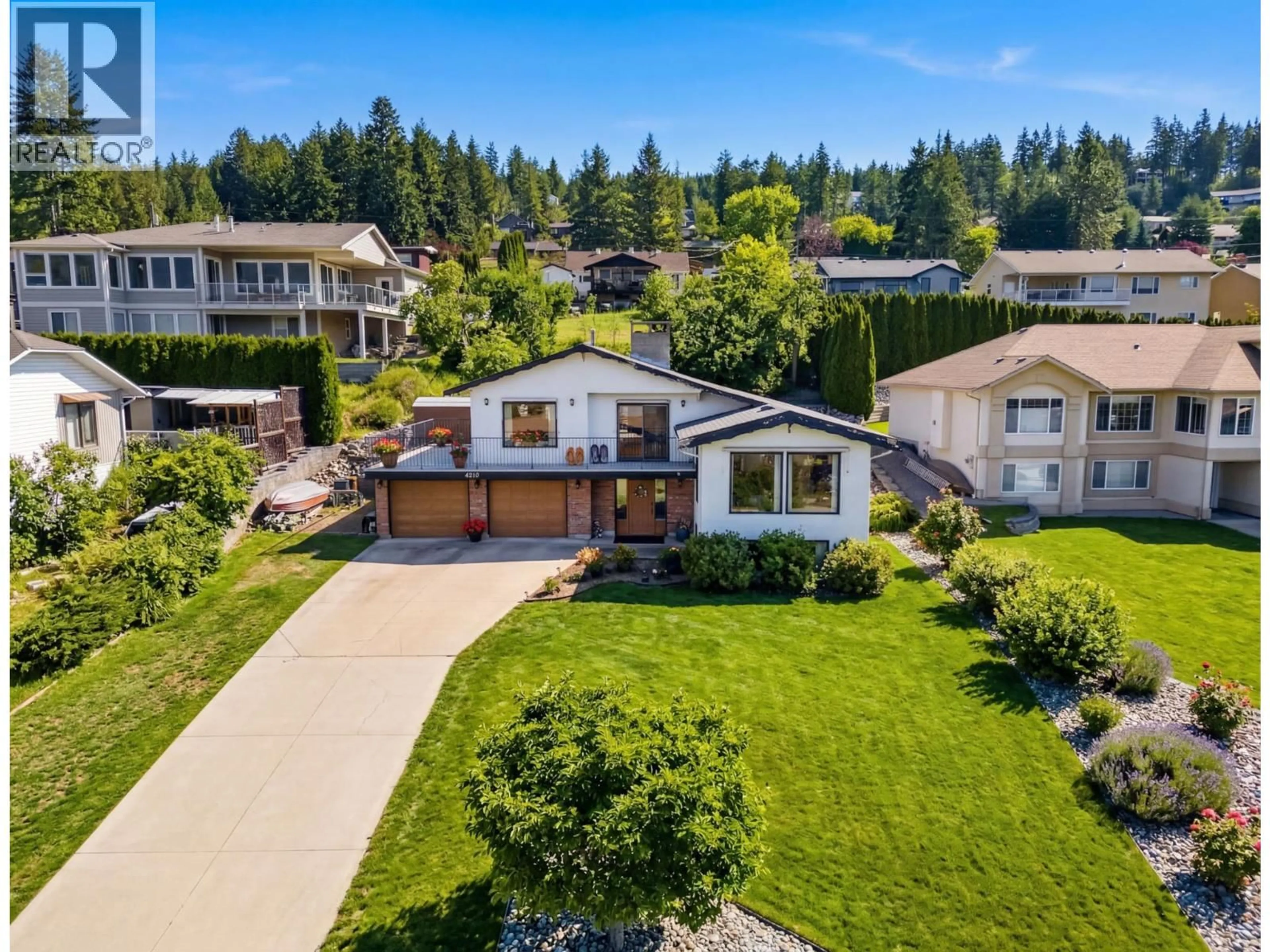 A pic from outside/outdoor area/front of a property/back of a property/a pic from drone, street for 4860 14 STREET NORTHEAST, Salmon Arm British Columbia V1E3P2