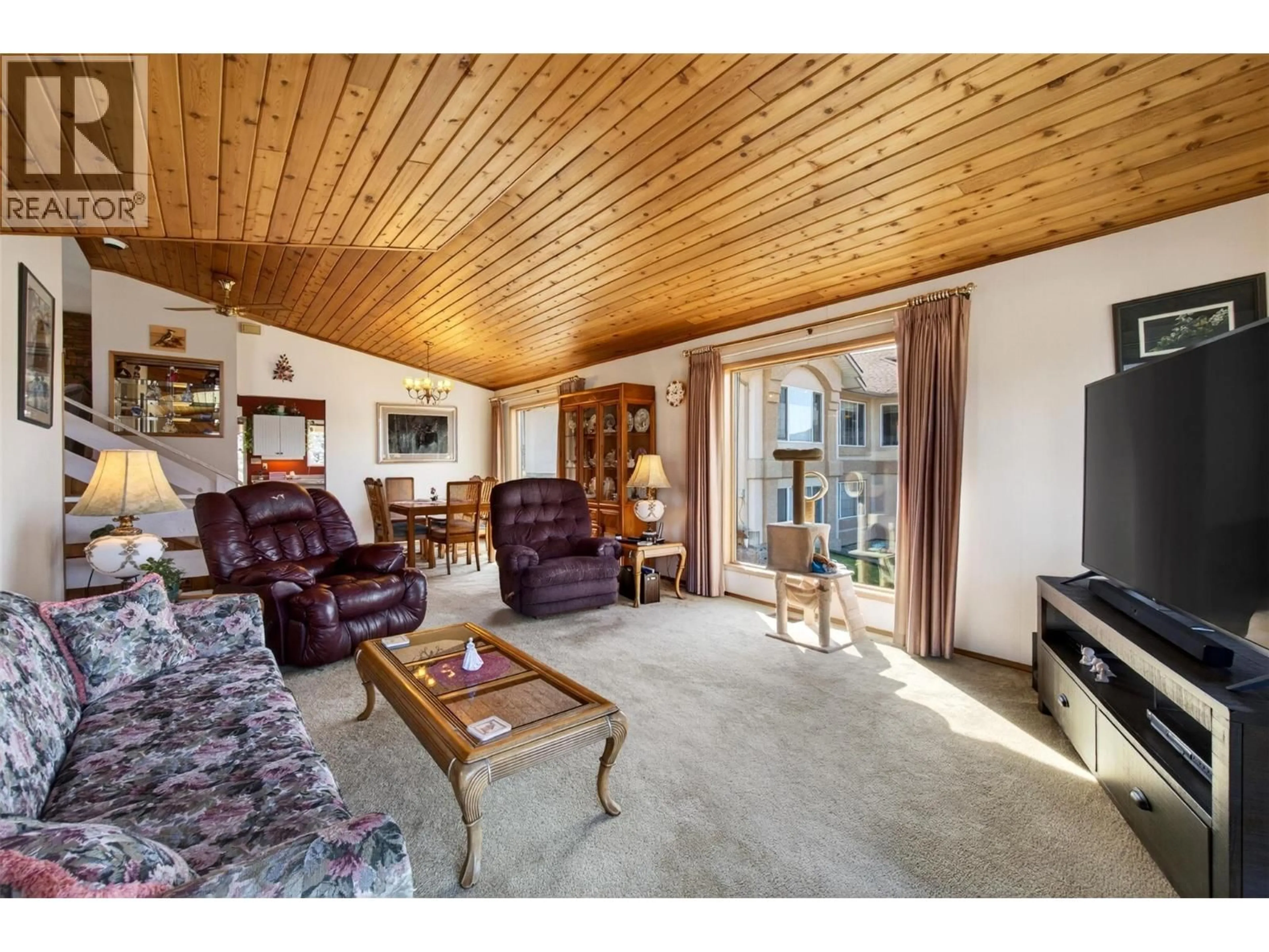 Living room with furniture, wood/laminate floor for 4860 14 STREET NORTHEAST, Salmon Arm British Columbia V1E3P2