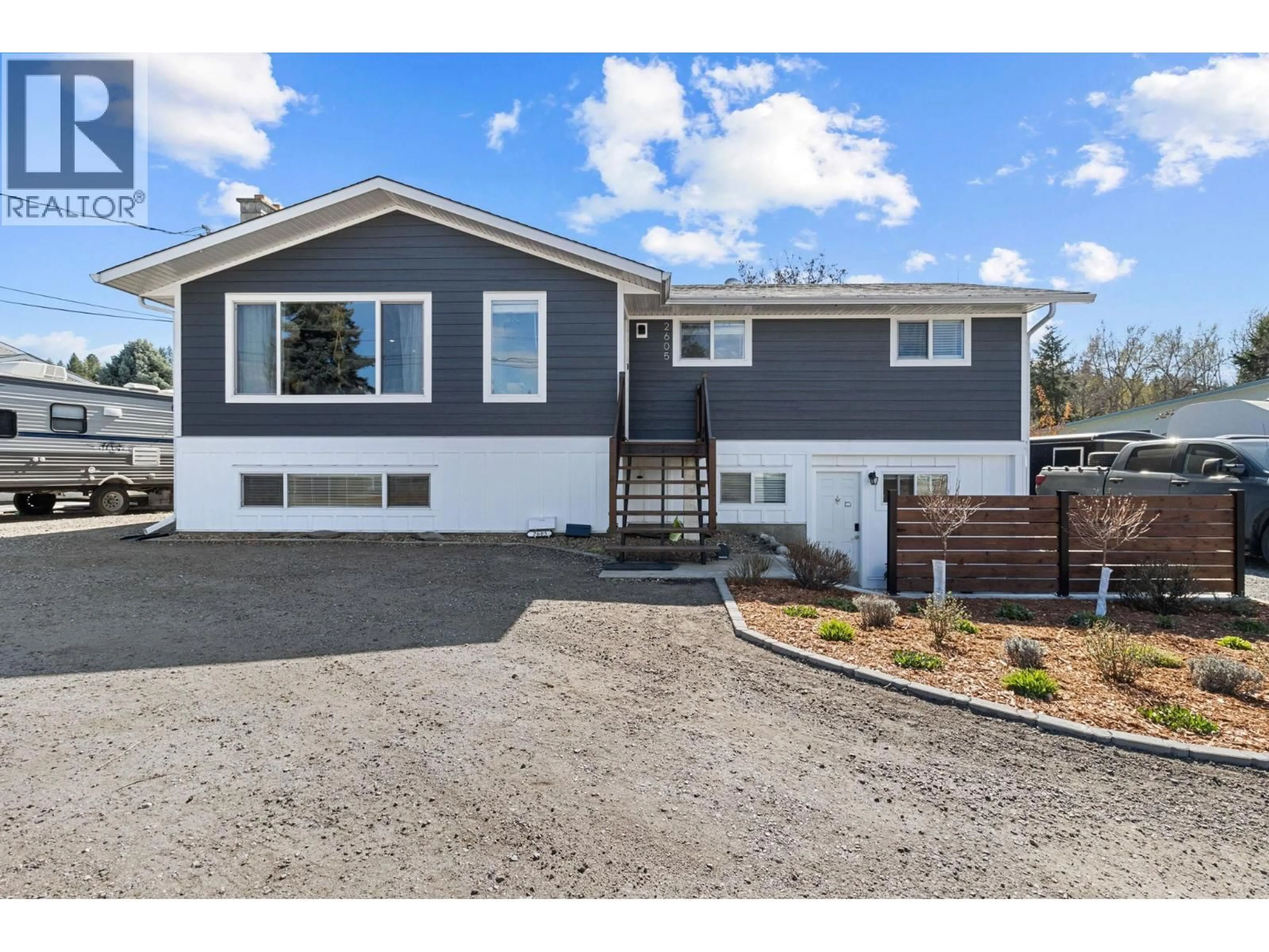 Home with vinyl exterior material, street for 2605 SPRINGFIELD ROAD, Kelowna British Columbia V1X1B9