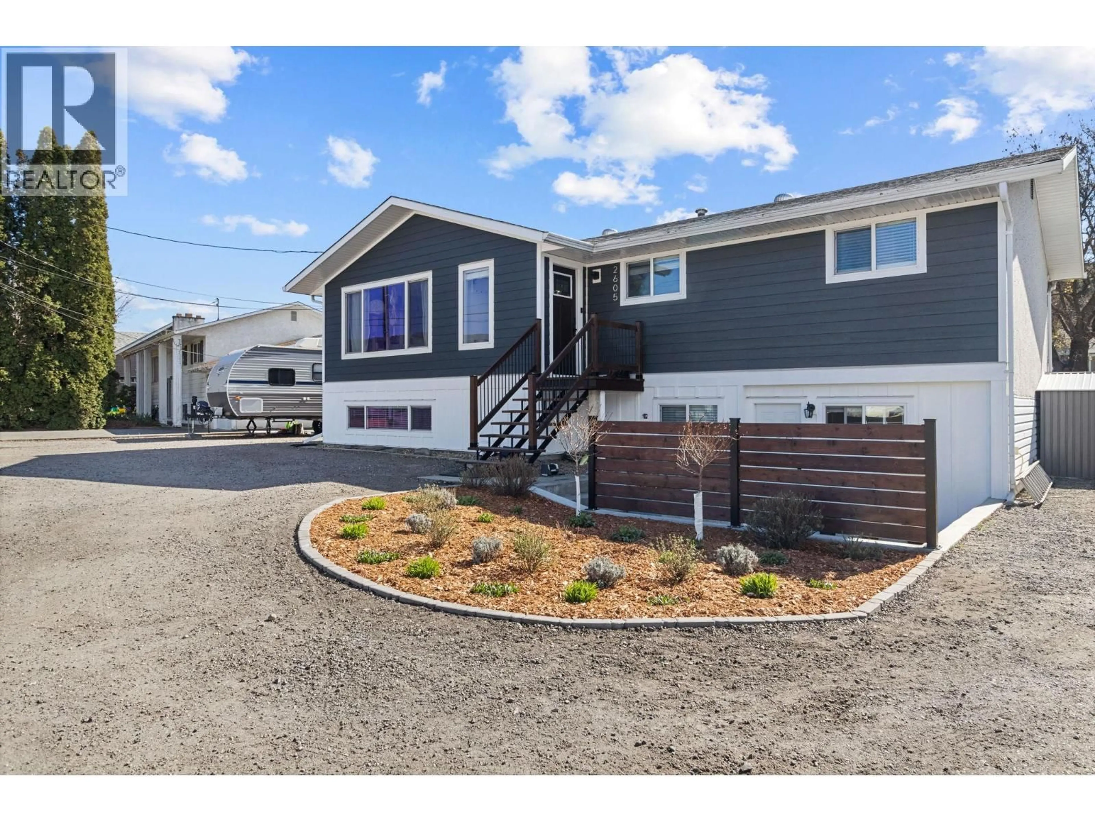 Home with vinyl exterior material, street for 2605 SPRINGFIELD ROAD, Kelowna British Columbia V1X1B9