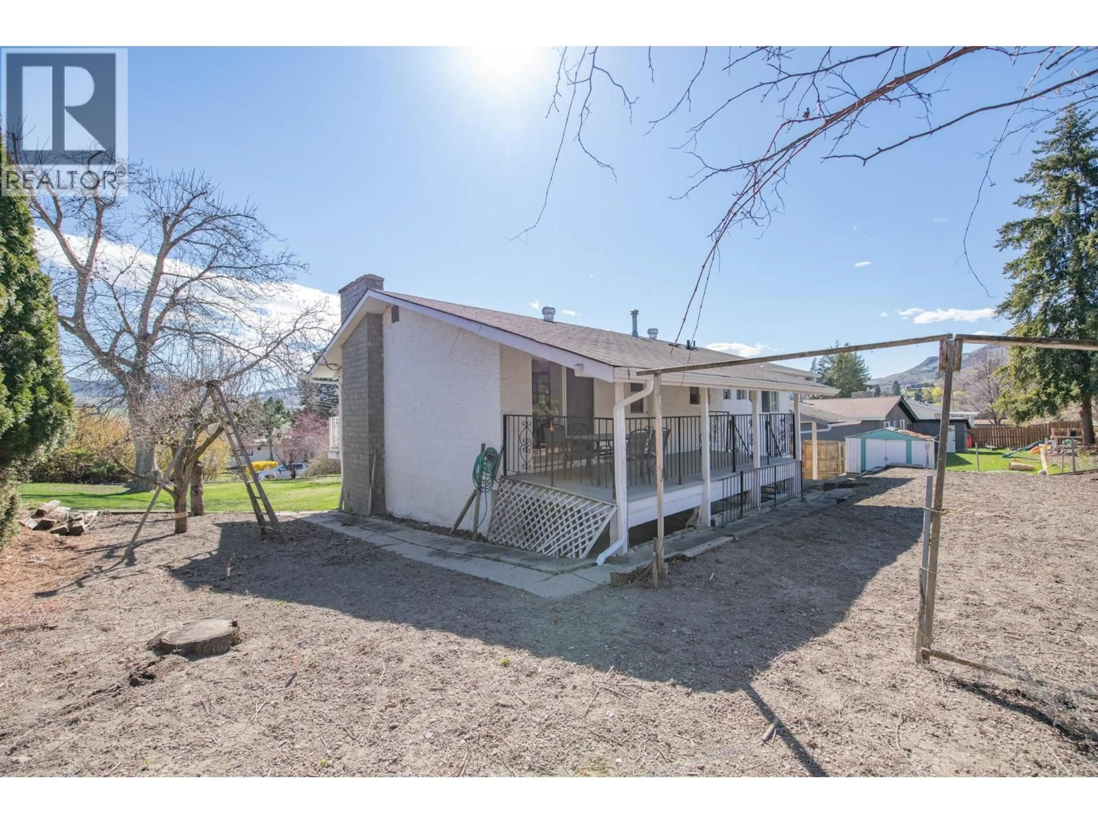 A pic from outside/outdoor area/front of a property/back of a property/a pic from drone, street for 5847 FLEMISH PLACE, Vernon British Columbia V1H1B2