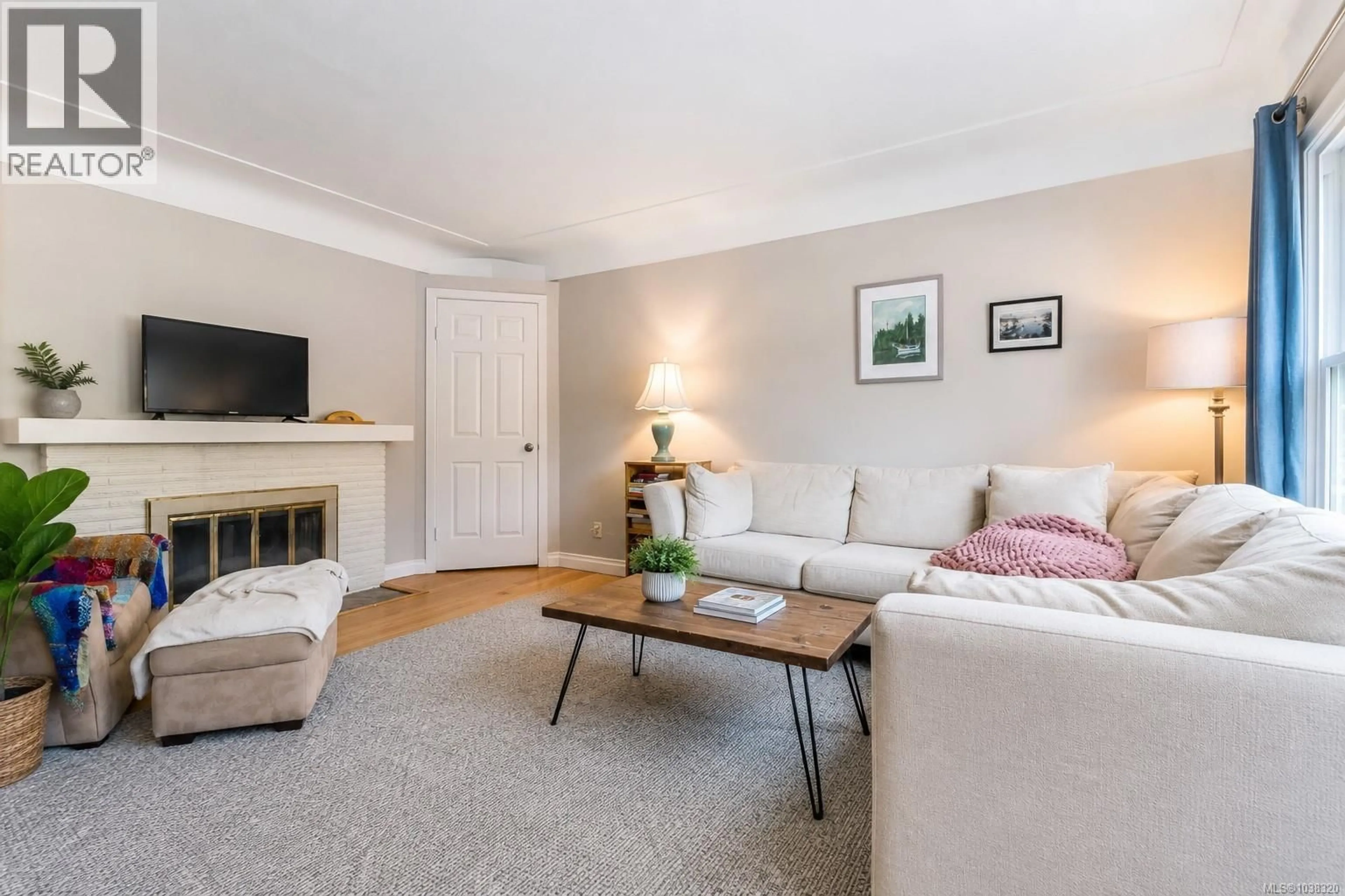 Living room with furniture, wood/laminate floor for 1736 CEDAR HILL CROSS ROAD, Saanich British Columbia V8P2R1