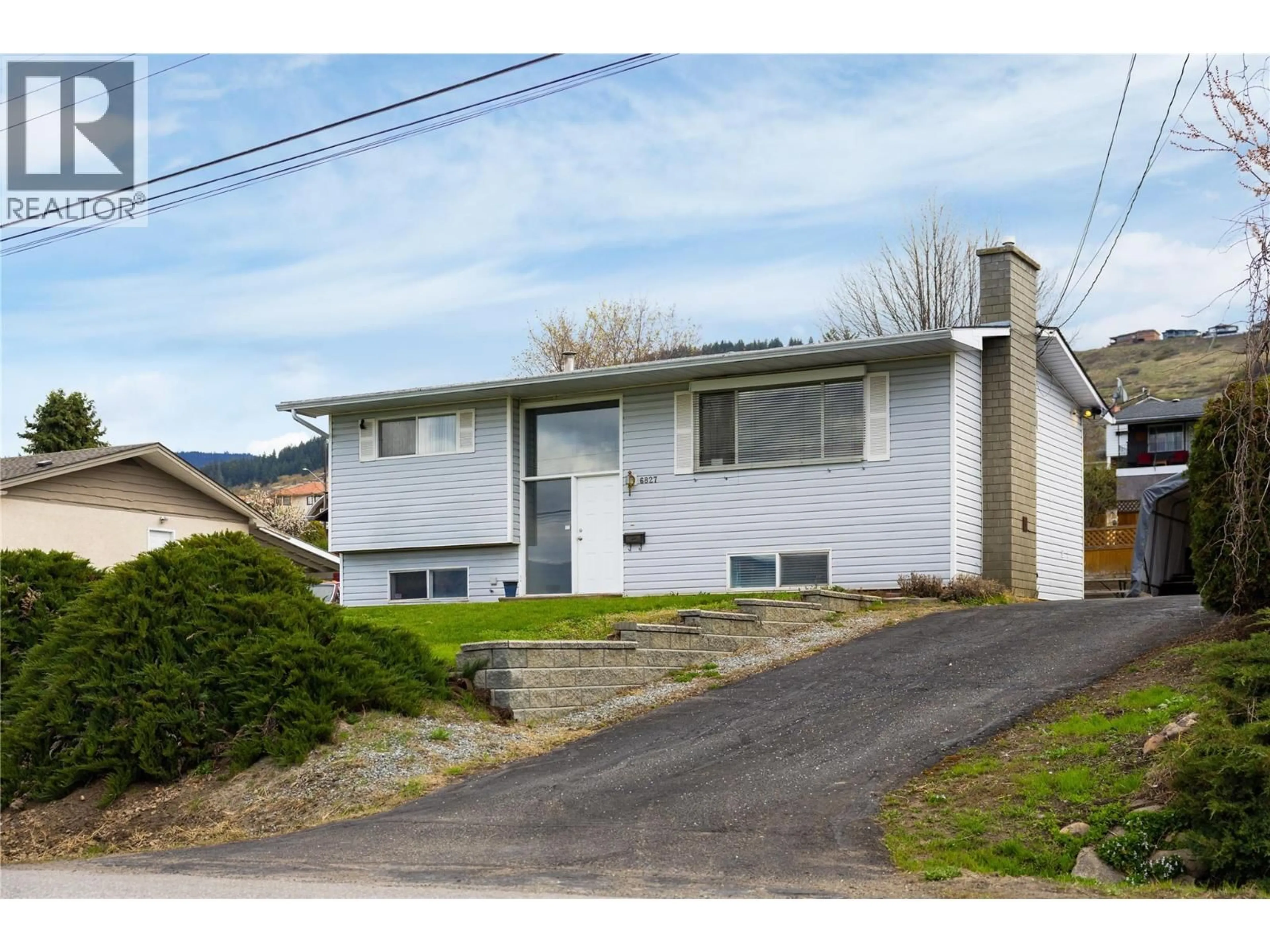 Home with vinyl exterior material, street for 6827 HERRY ROAD, Vernon British Columbia V1B3T4