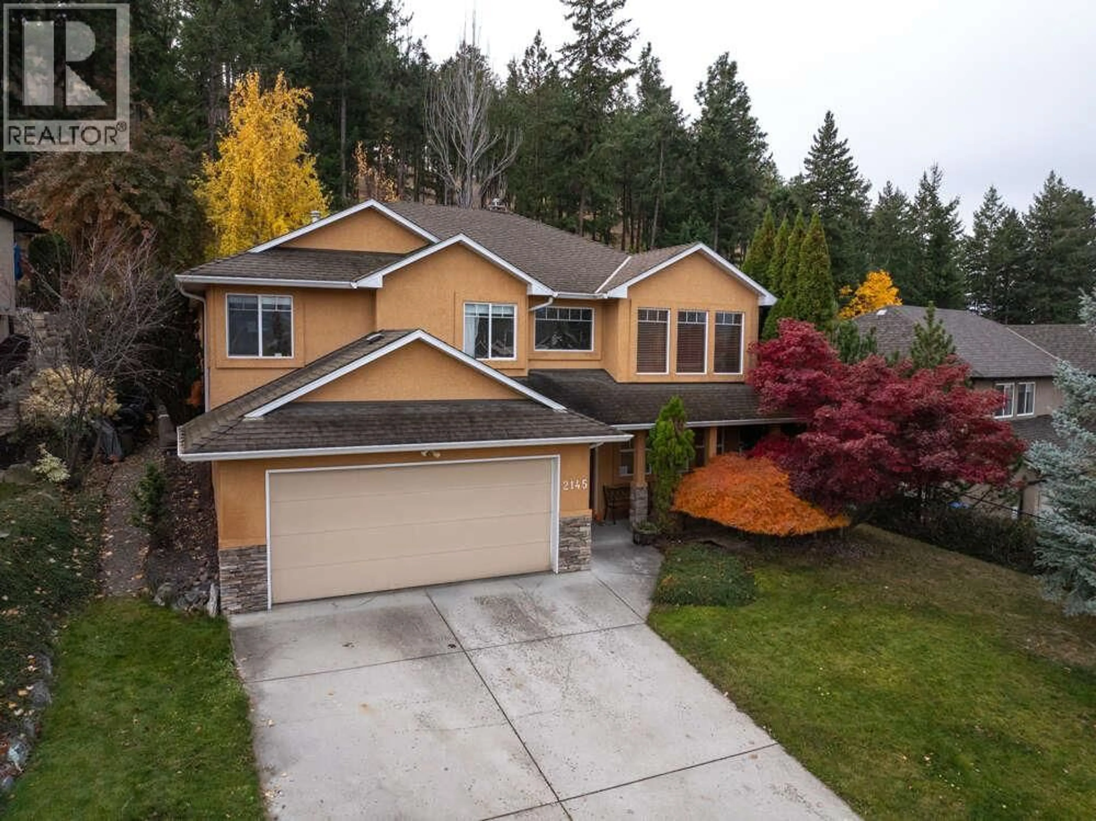 A pic from outside/outdoor area/front of a property/back of a property/a pic from drone, street for 2145 CHILCOTIN CRESCENT, Kelowna British Columbia V1V2N9