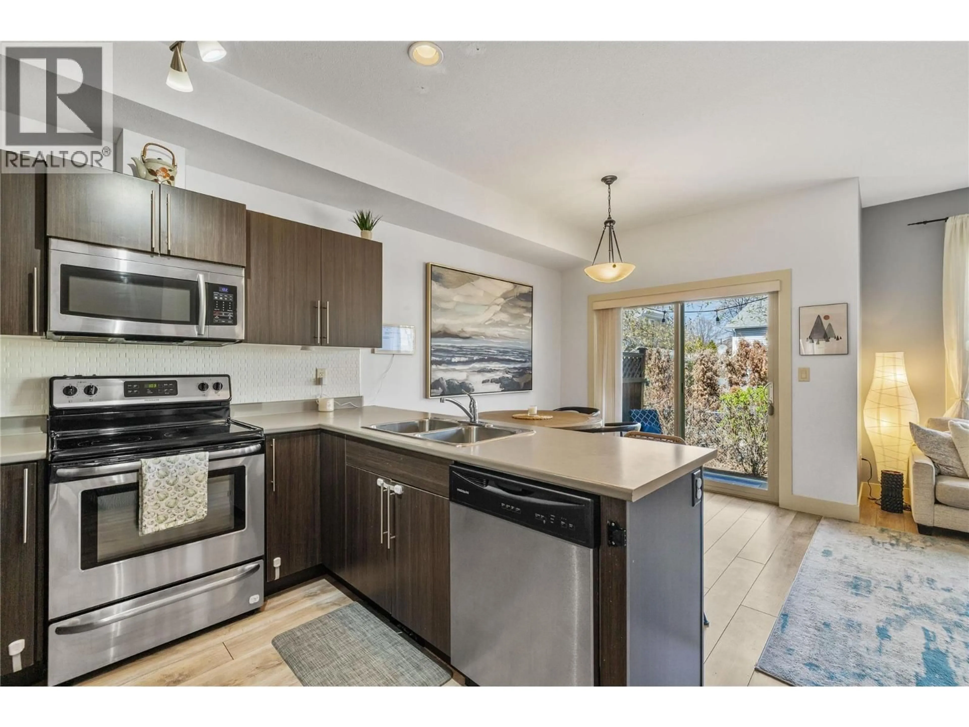 Open concept kitchen, ceramic/tile floor for 4 - 335 GERSTMAR ROAD, Kelowna British Columbia V1X4A6