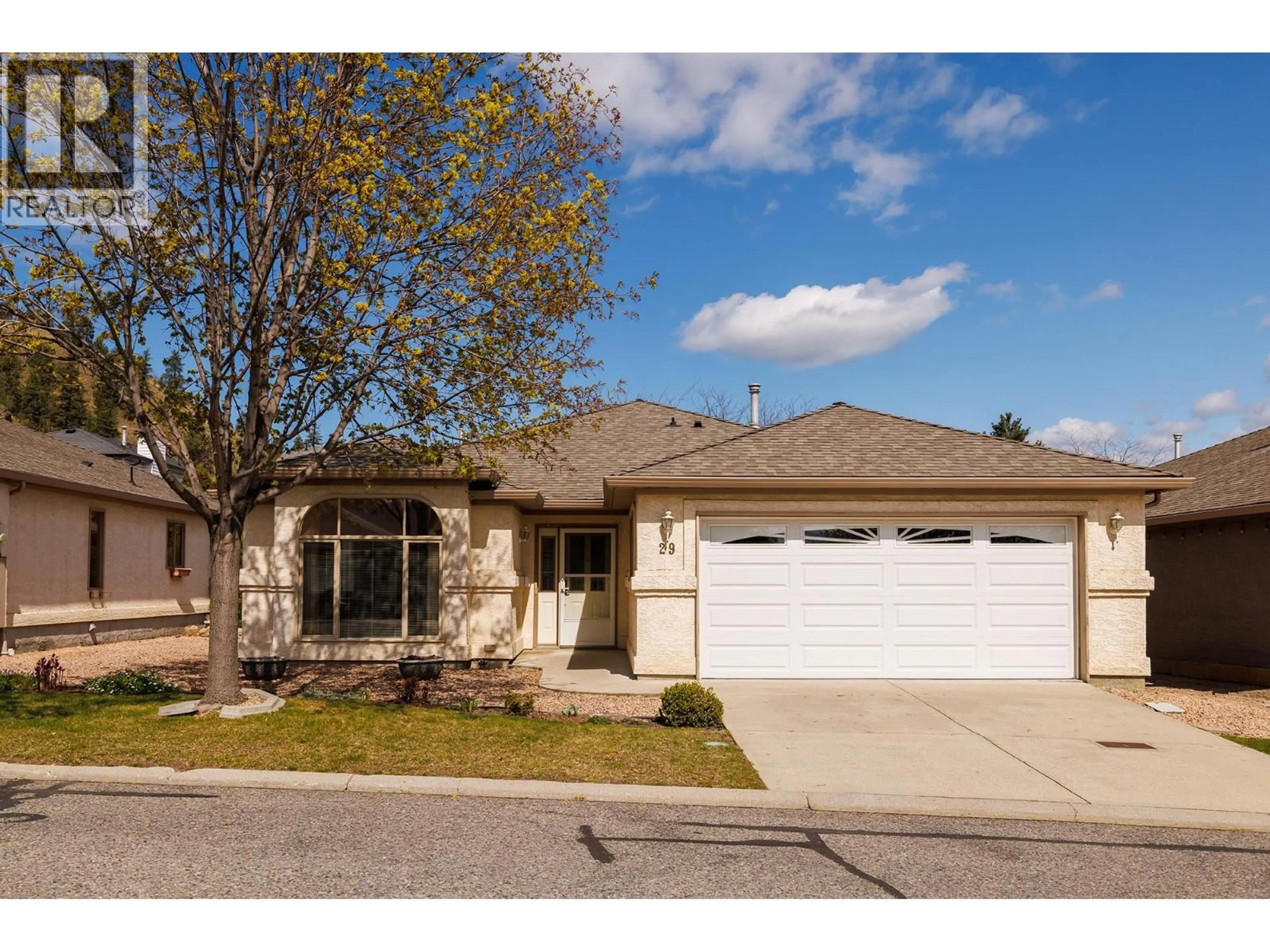 Home with vinyl exterior material, street for 29 - 615 GLENMEADOWS ROAD, Kelowna British Columbia V1V1N9