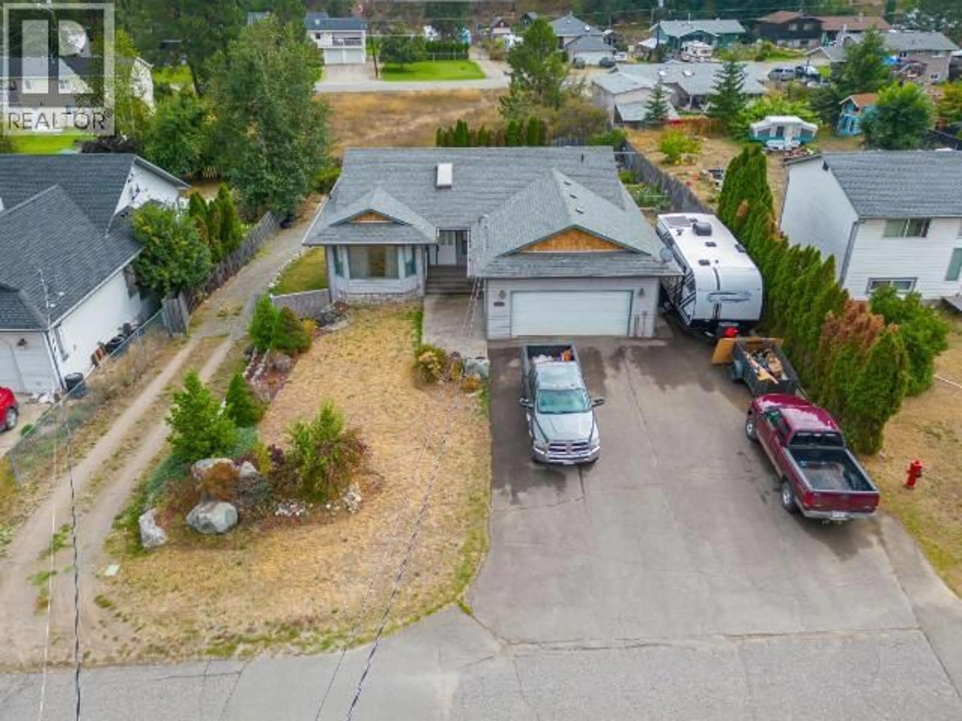 A pic from outside/outdoor area/front of a property/back of a property/a pic from drone, street for 4728 SPRUCE CRESCENT, Barriere British Columbia V0E1E0