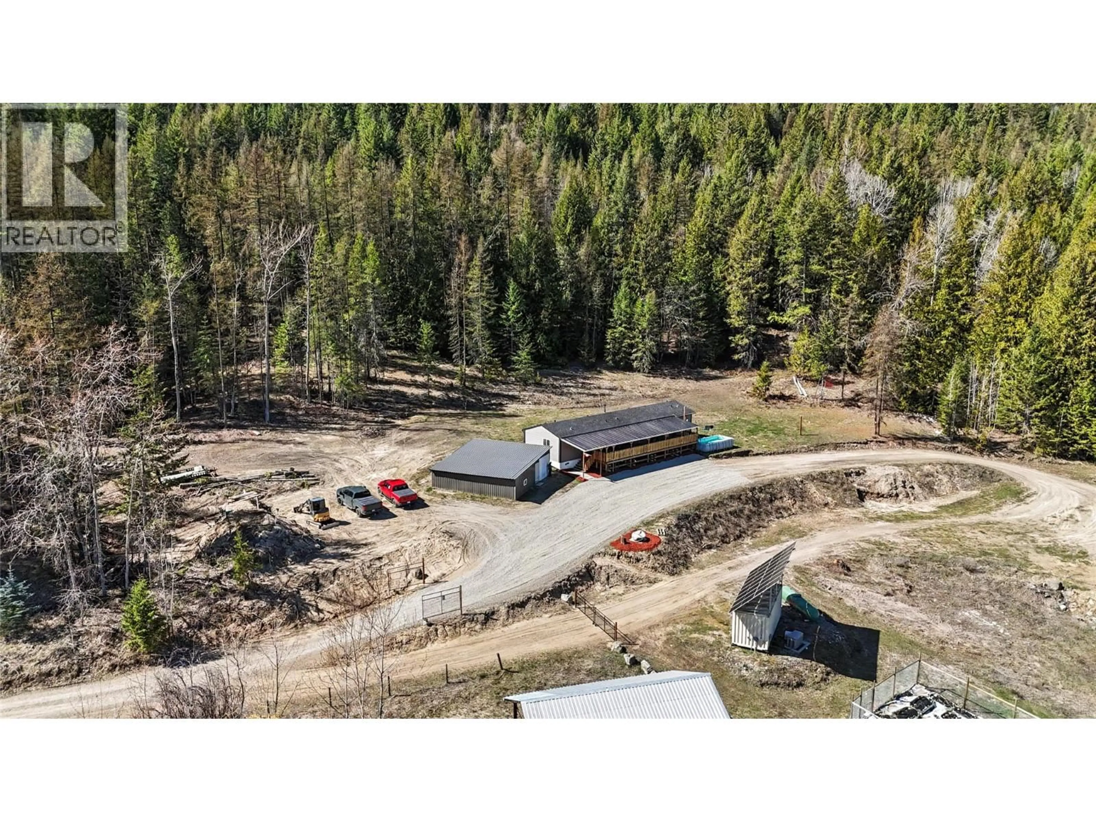 A pic from outside/outdoor area/front of a property/back of a property/a pic from drone, forest/trees view for 10899 SEABROOK ROAD, Grand Forks British Columbia V0H1H8