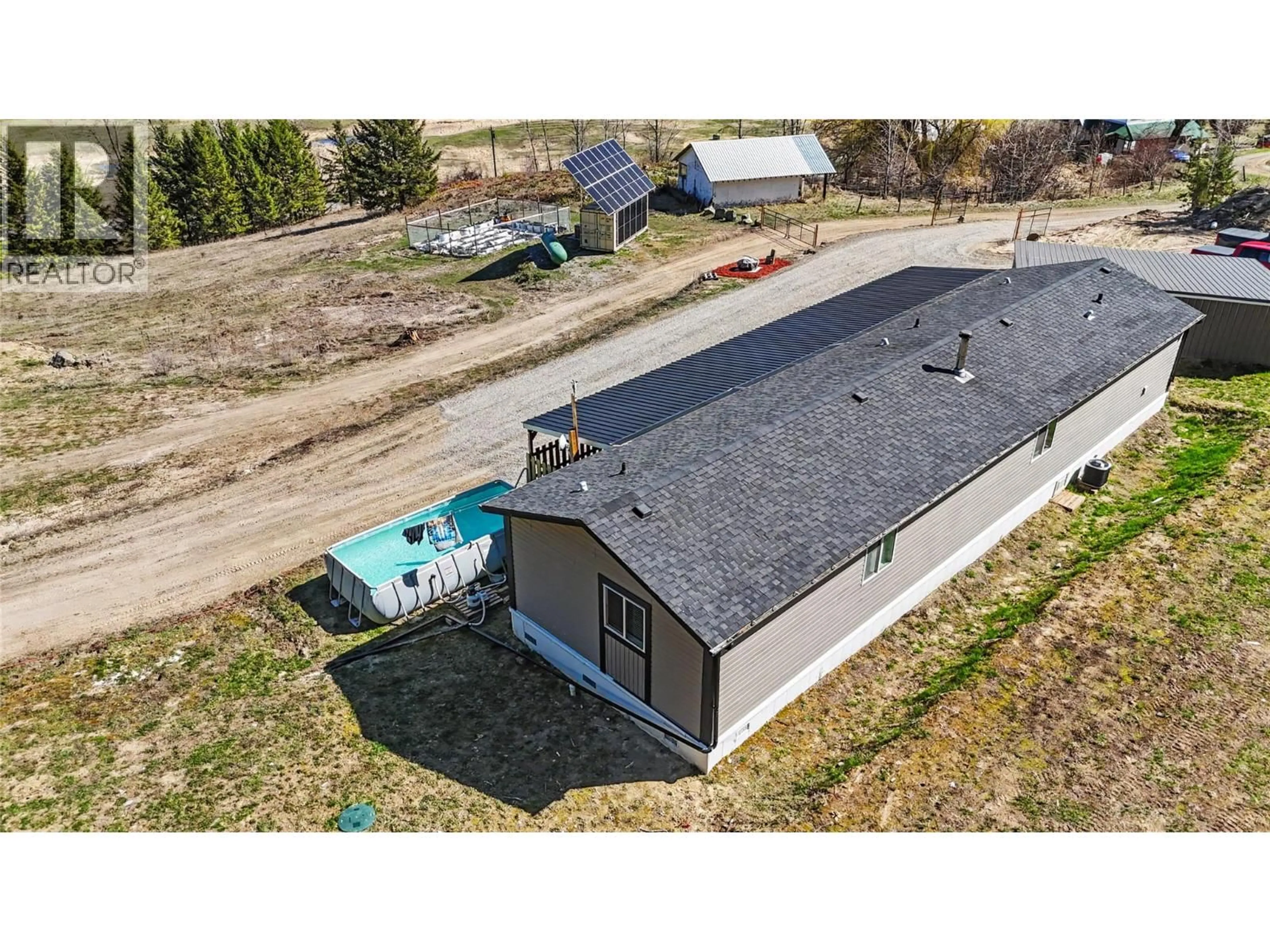A pic from outside/outdoor area/front of a property/back of a property/a pic from drone, building for 10899 SEABROOK ROAD, Grand Forks British Columbia V0H1H8