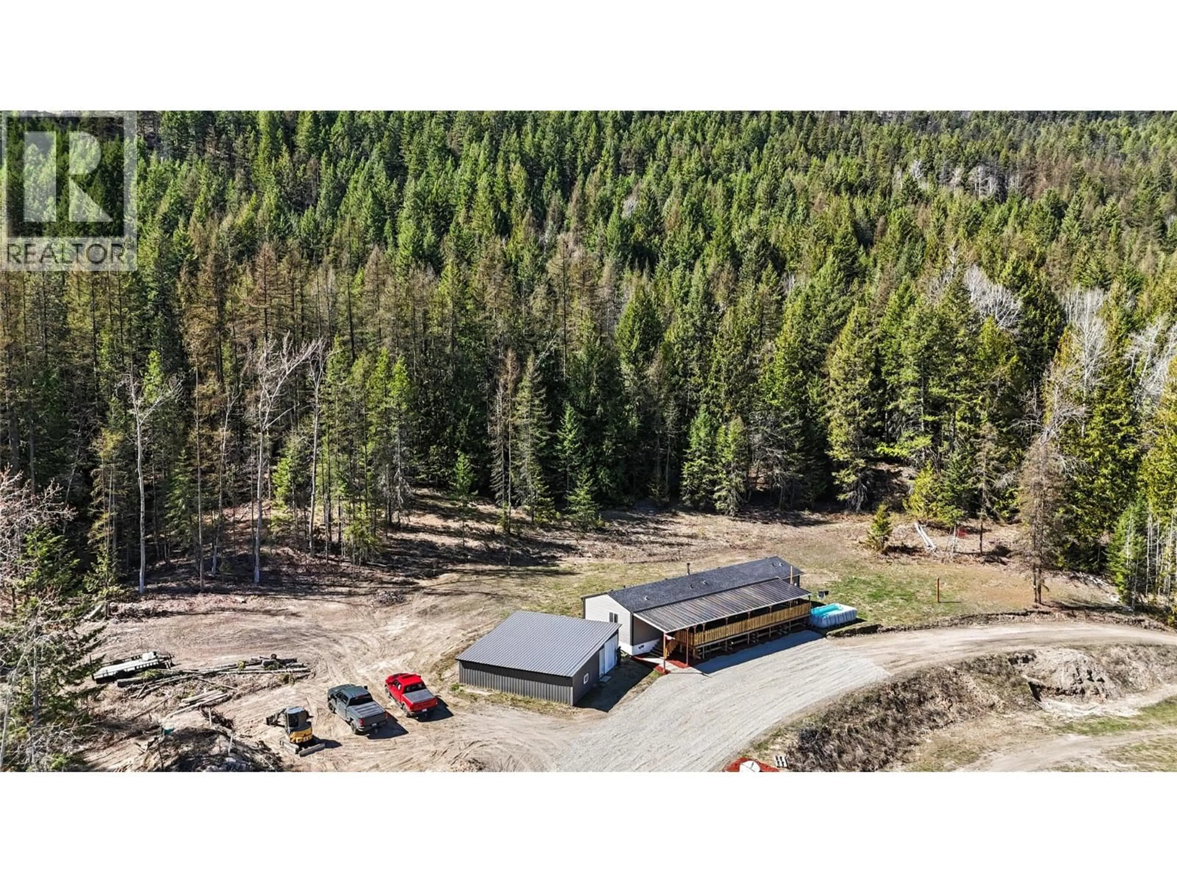 A pic from outside/outdoor area/front of a property/back of a property/a pic from drone, forest/trees view for 10899 SEABROOK ROAD, Grand Forks British Columbia V0H1H8
