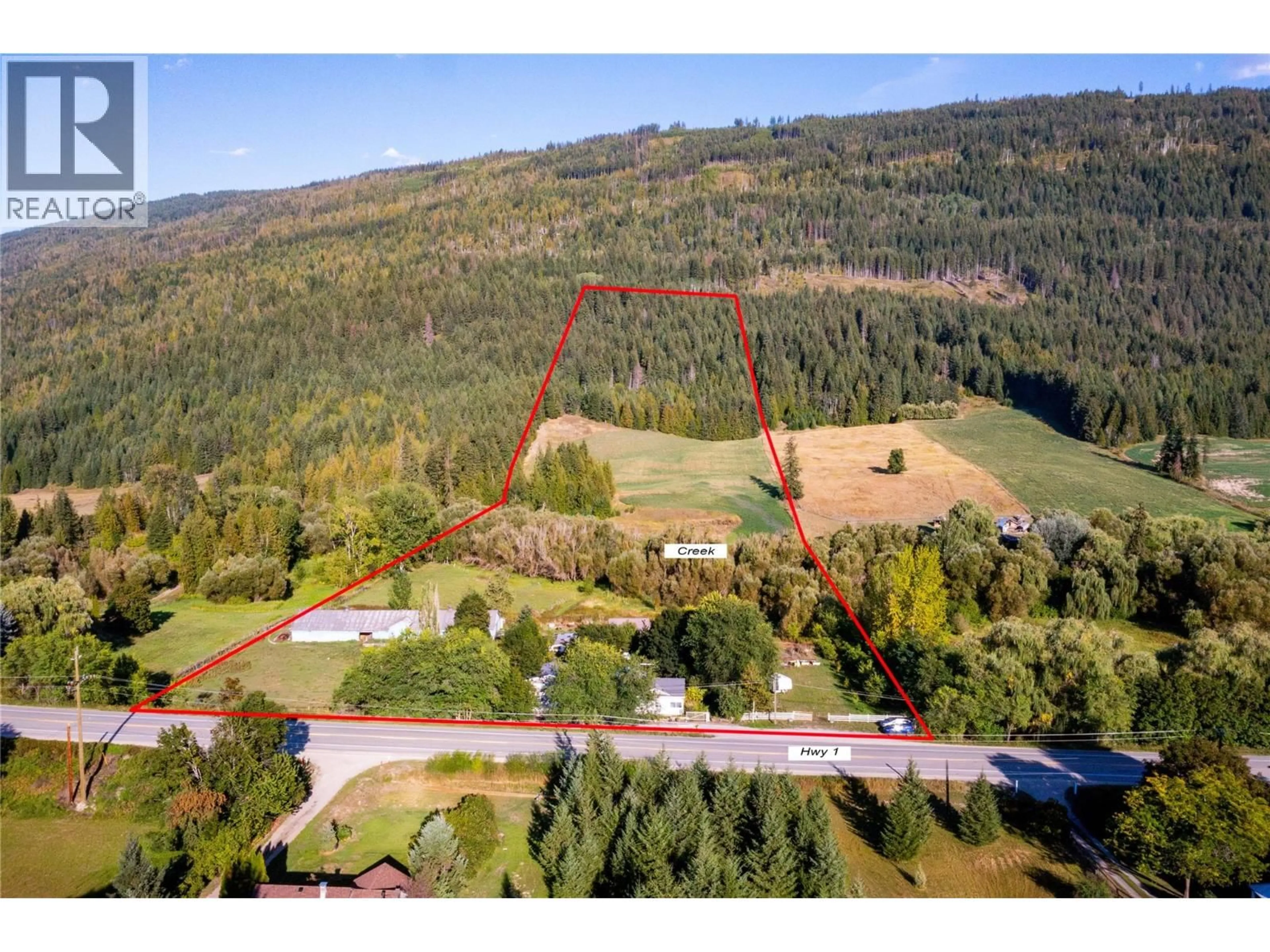 A pic from outside/outdoor area/front of a property/back of a property/a pic from drone, forest/trees view for 4350 50 STREET NORTHEAST, Salmon Arm British Columbia V1E1Y5