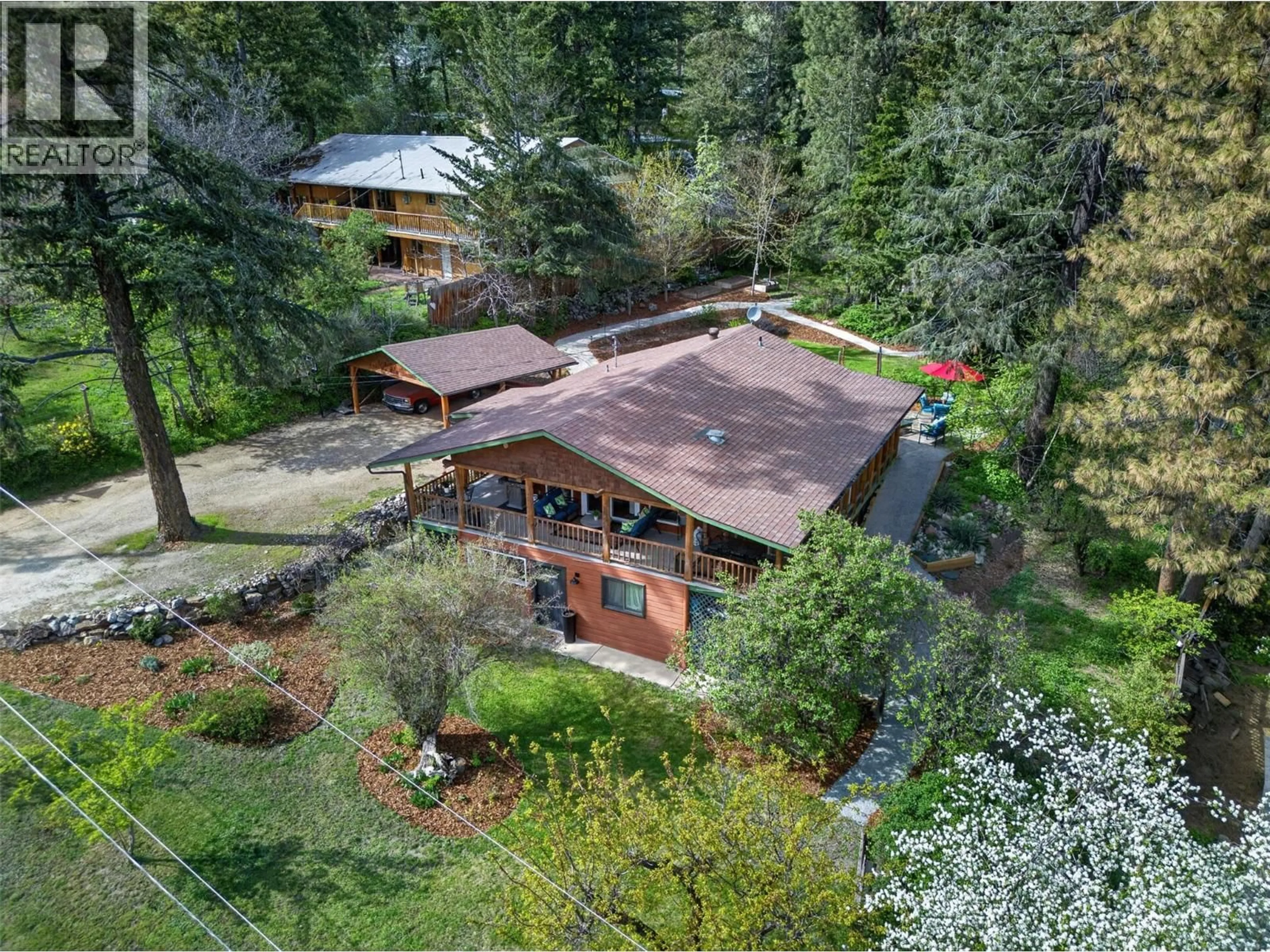 A pic from outside/outdoor area/front of a property/back of a property/a pic from drone, unknown for 374 KILDARE WAY, Vernon British Columbia V1H2C7