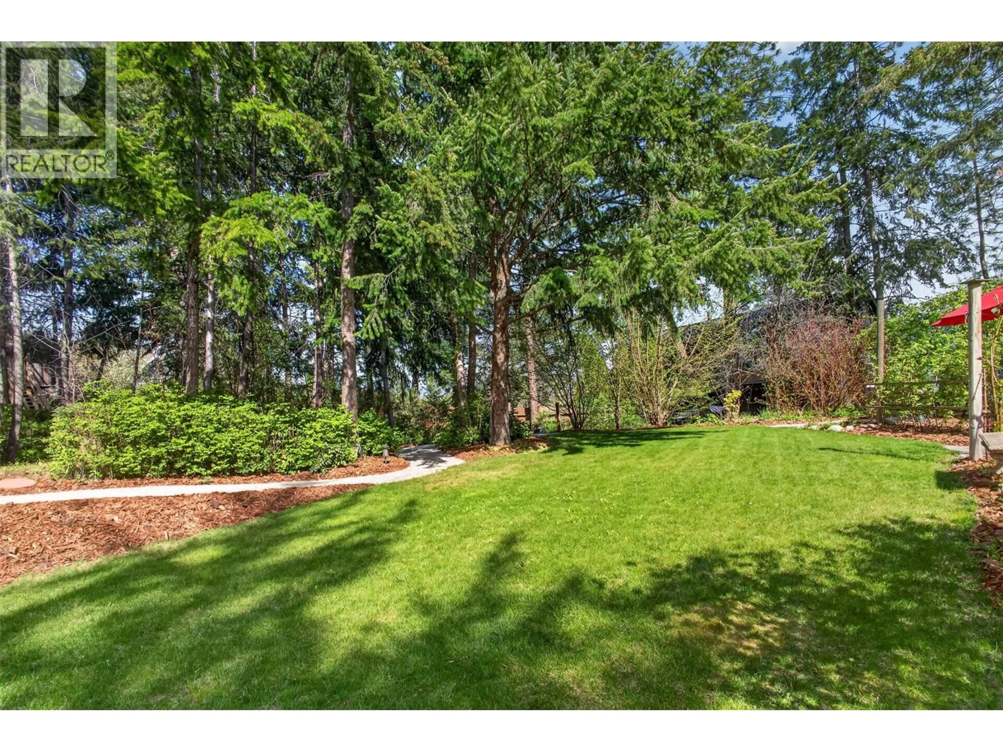 A pic from outside/outdoor area/front of a property/back of a property/a pic from drone, forest/trees view for 374 KILDARE WAY, Vernon British Columbia V1H2C7