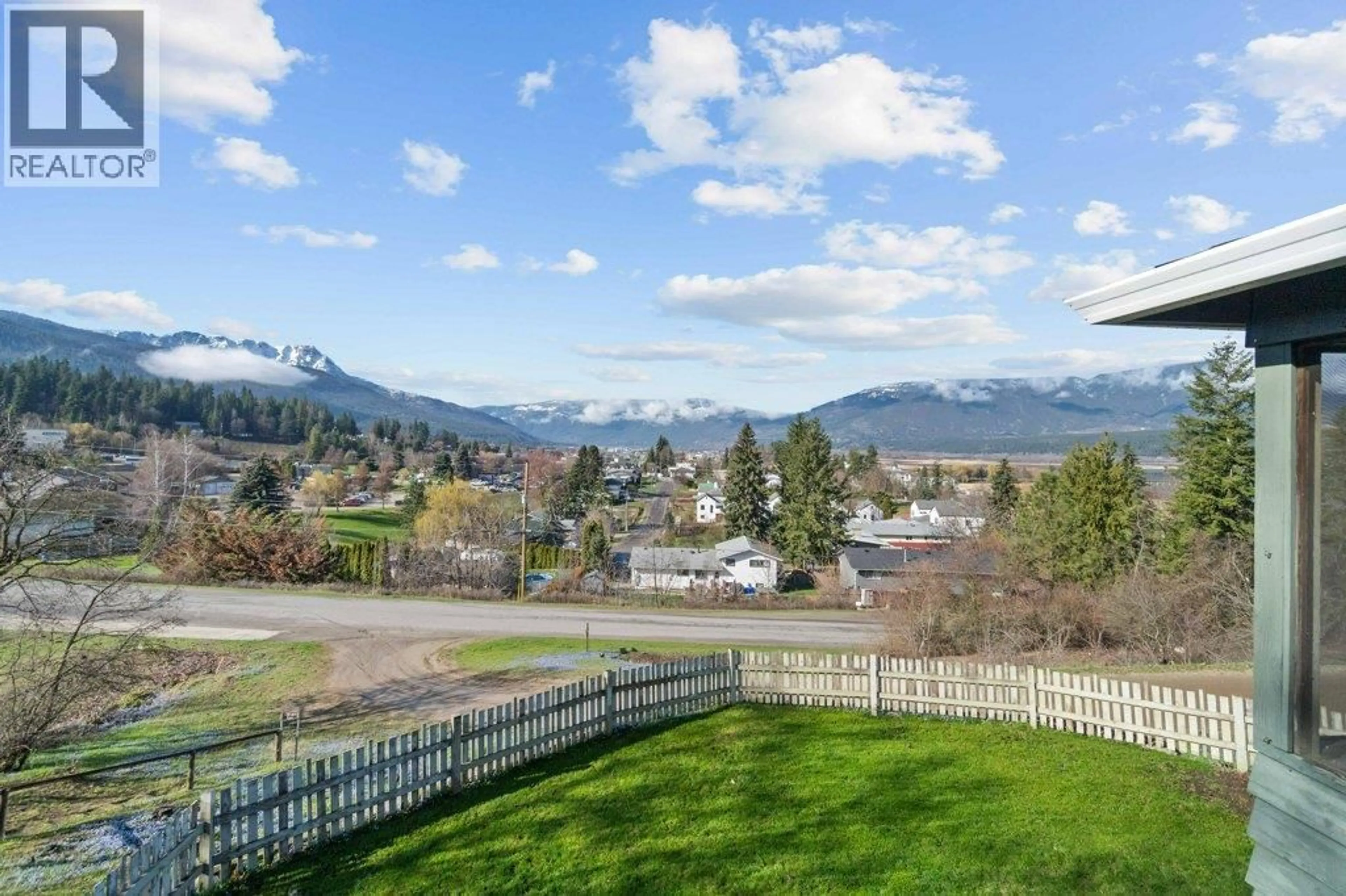 A pic from outside/outdoor area/front of a property/back of a property/a pic from drone, mountain view for 1321 10 AVENUE NORTHEAST, Salmon Arm British Columbia V1E2V6