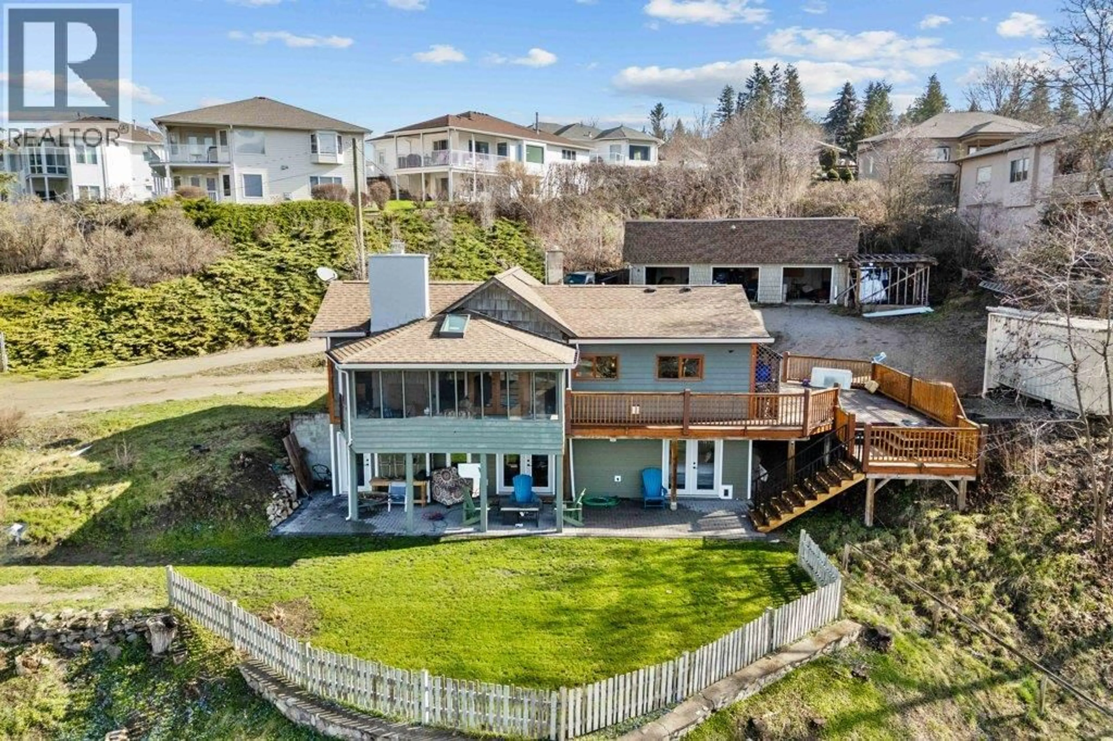A pic from outside/outdoor area/front of a property/back of a property/a pic from drone, water/lake/river/ocean view for 1321 10 AVENUE NORTHEAST, Salmon Arm British Columbia V1E2V6