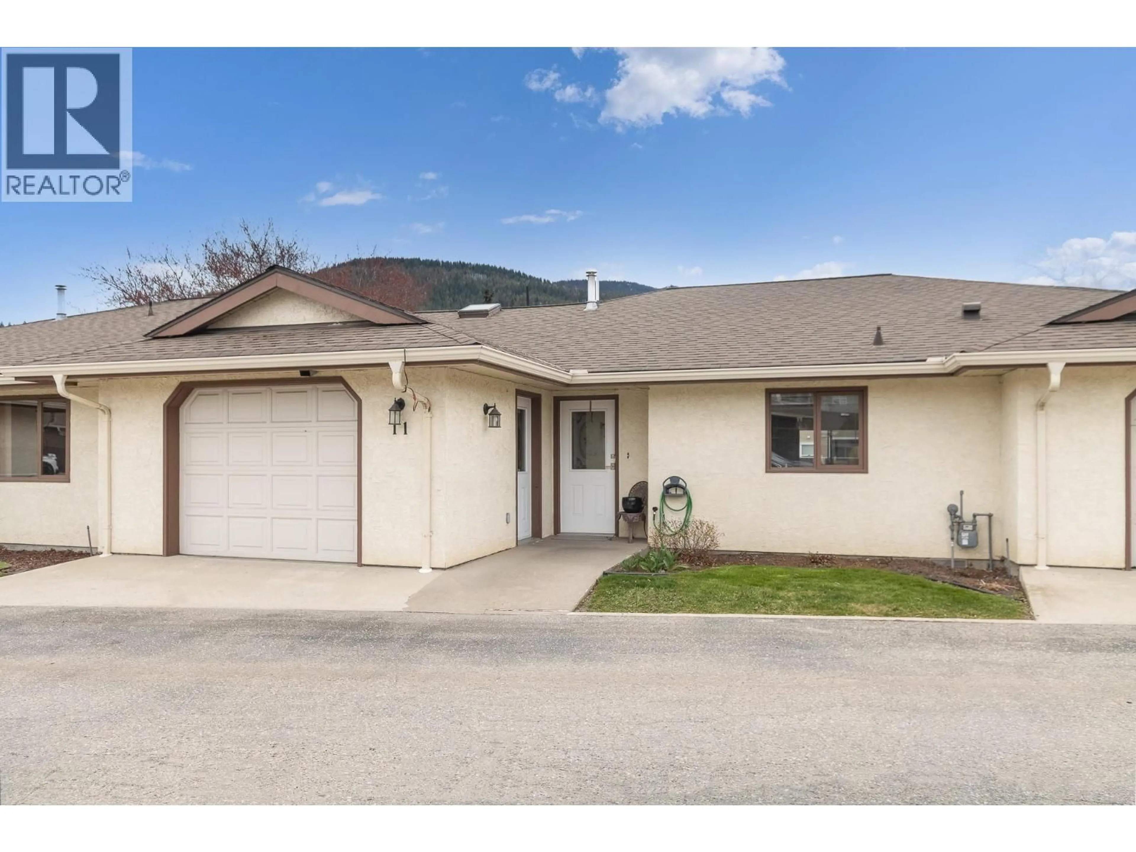 Home with vinyl exterior material, street for 11 - 151 8 AVENUE SOUTHWEST, Salmon Arm British Columbia V1E1B9