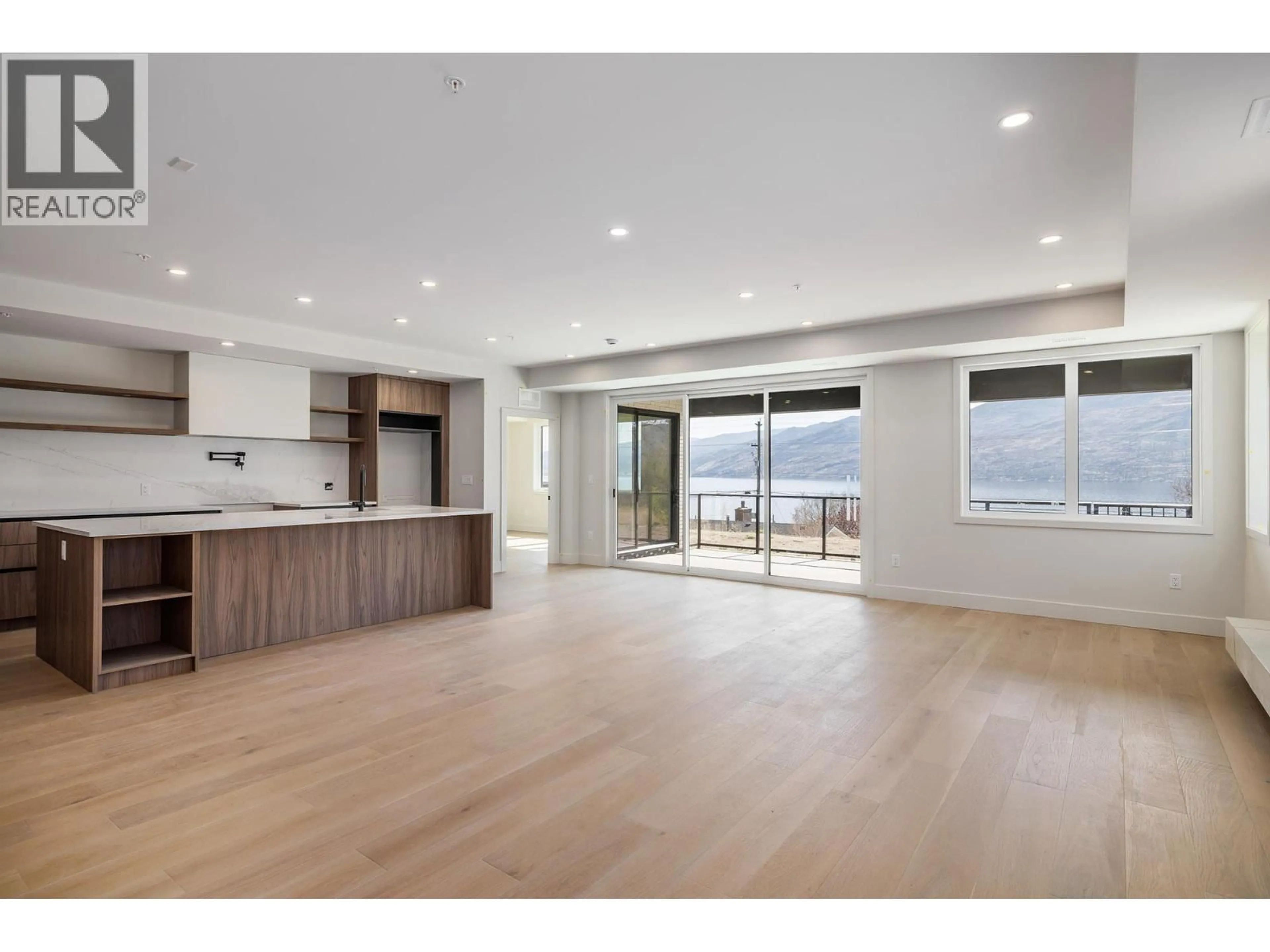 Open concept kitchen, wood/laminate floor for 102 - 5304 BUCHANAN ROAD, Peachland British Columbia V0H1X1